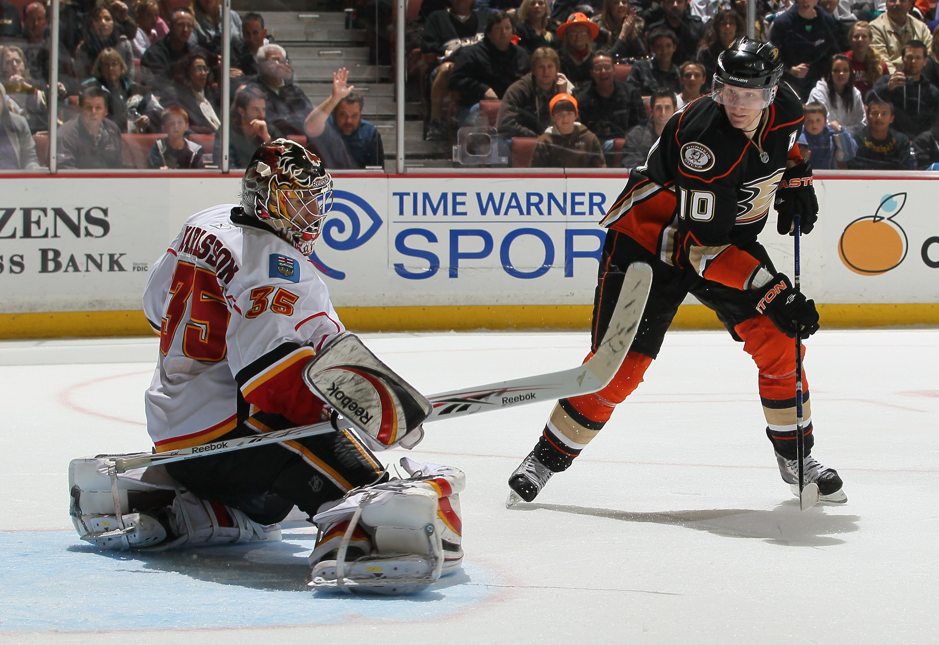ANAHEIM, CA - DECEMBER 10:  Goaltender Henrik Karlsson #35 of the Calgary Flames defends against Corey Perry #10 of the Anaheim Ducks at the Honda Center on December 10, 2010 in Anaheim, California. (Photo by Jeff Gross/Getty Images)