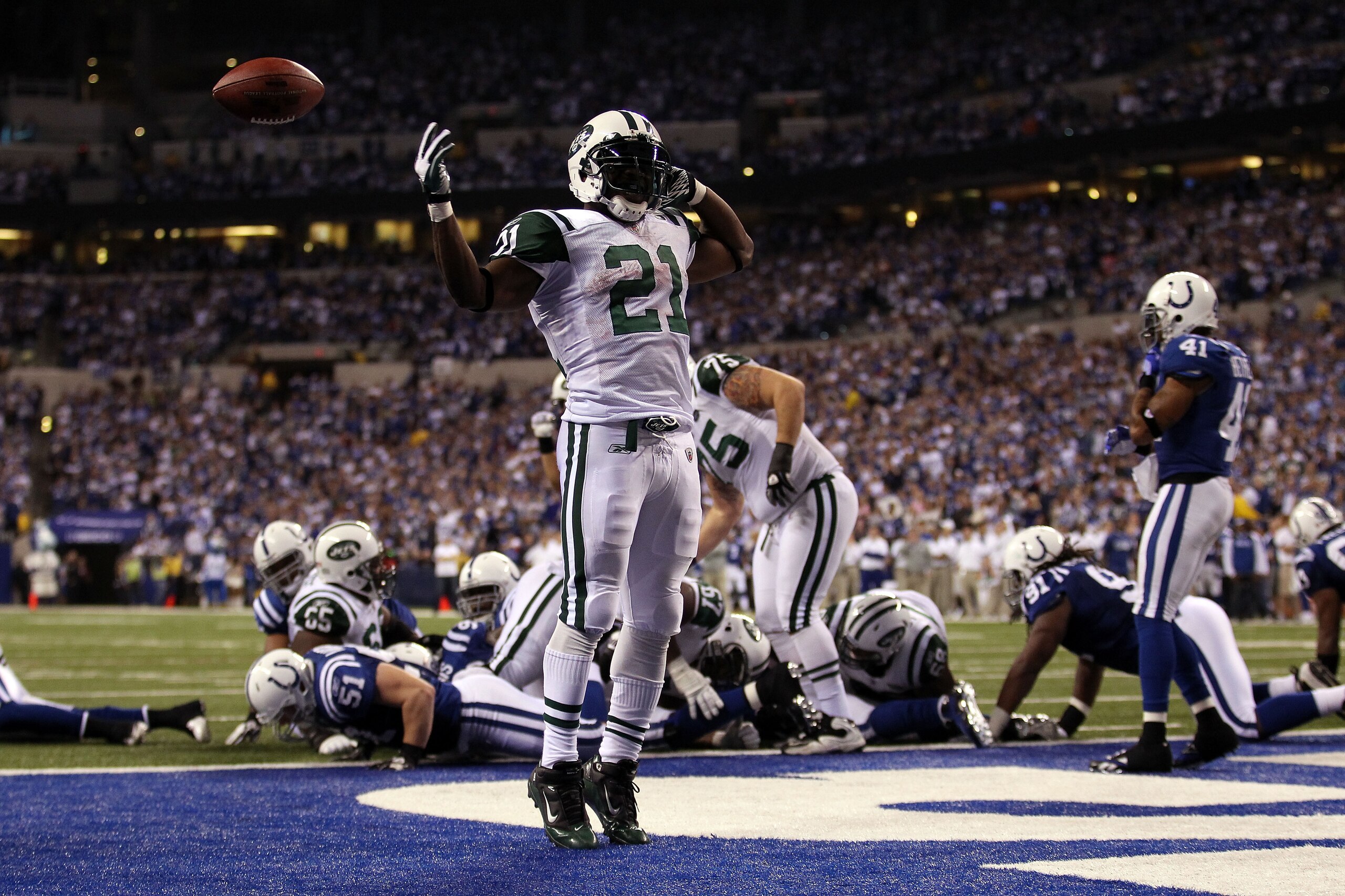 INDIANAPOLIS, IN - JANUARY 08: LaDainian Tomlinson #21 of the New York Jets celebrates after he scored a 1-yard rushing touchdown in the fourth quarter against the Indianapolis Colts during their 2011 AFC wild card playoff game at Lucas Oil Stadium on Ja INDIANAPOLIS, IN - JANUARY 08: LaDainian Tomlinson #21 of the New York Jets celebrates after he scored a 1-yard rushing touchdown in the fourth quarter against the Indianapolis Colts during their 2011 AFC wild card playoff game at Lucas Oil Stadium on Ja
