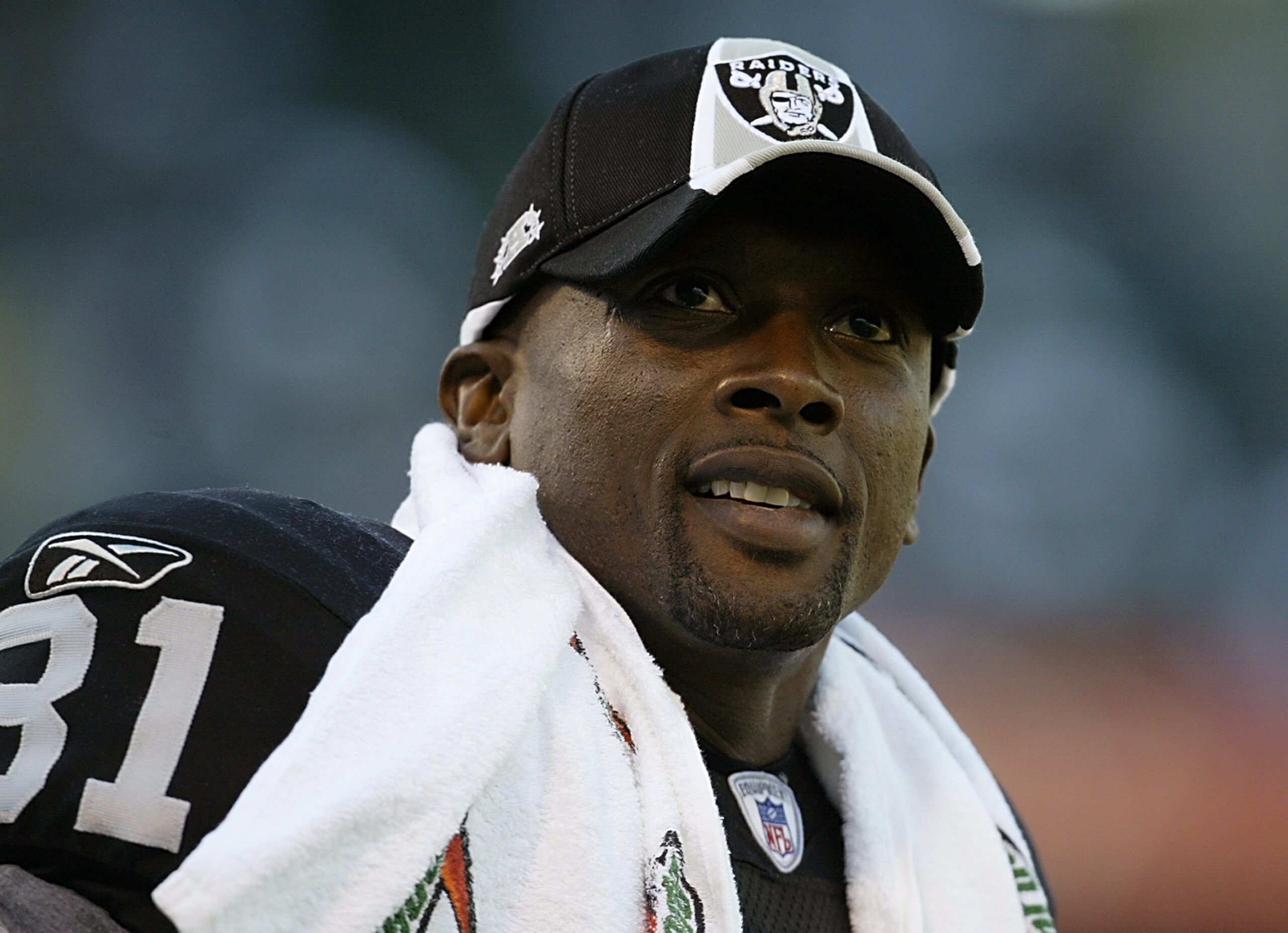 OAKLAND, CA - AUGUST 8:  Tim Brown #81 of the Oakland Raiders looks on from the sideline during the game against the St. Louis Rams at the Network Associates Coliseum on August 8, 2003 in Oakland, California.  The Raiders defeated the Rams 7-6.  (Photo by