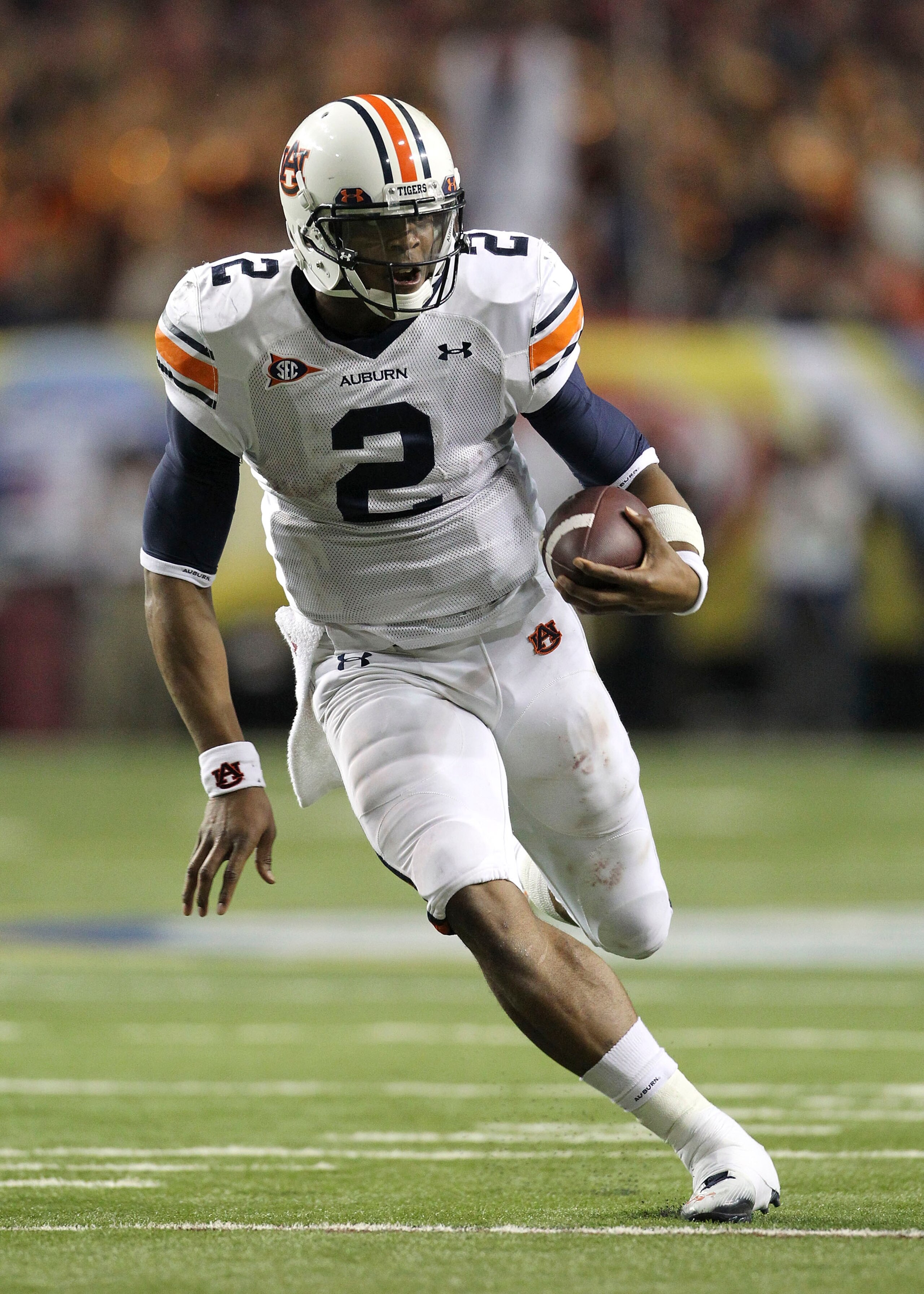ATLANTA - DECEMBER 4:  Quarterback Cam Newton #2 of the Auburn Tigers runs with the ball during the 2010 SEC Championship against the South Carolina Gamecocks at Georgia Dome on December 4, 2010 in Atlanta, Georgia. (Photo by Mike Zarrilli/Getty Images)
