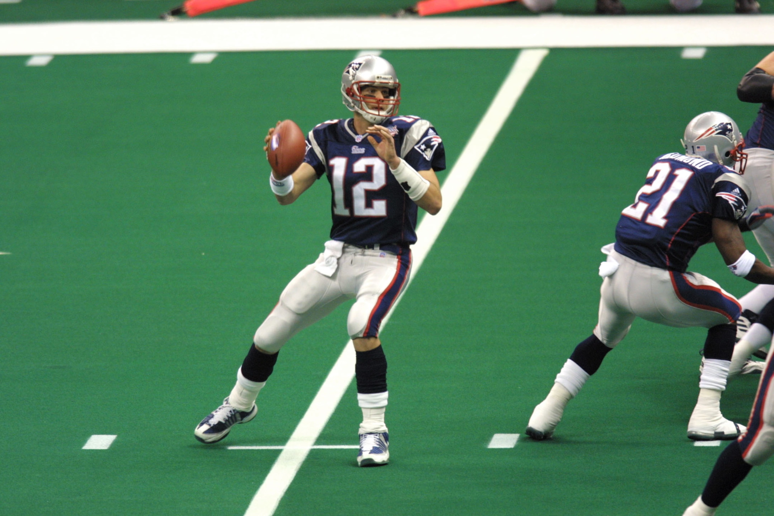 03 Feb 2002:  Quarterback Tom Brady #12 of the New England Patriots looks to throw a pass against the St.Louis Rams  during Superbowl XXXVI at the Superdome in New Orleans, Louisiana.  The Patriots defeated the Rams 20-17. DIGITAL IMAGE. Mandatory Credit: