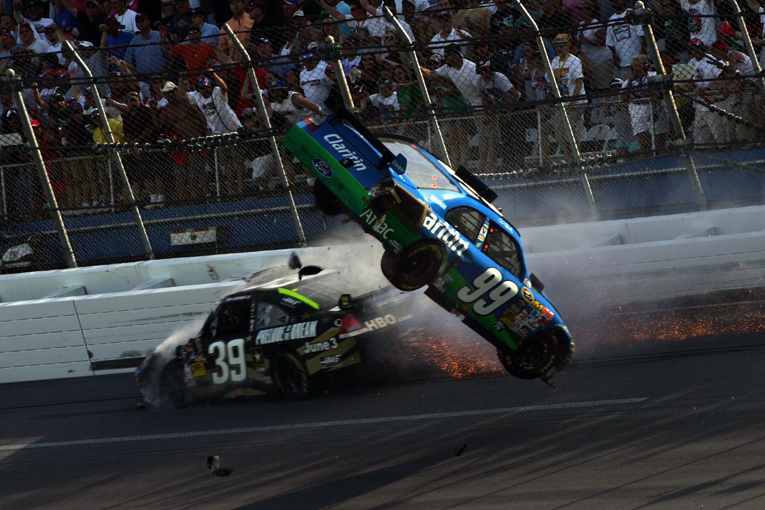 TALLADEGA, AL - APRIL 26:  Carl Edwards, driver of the #99 Claritin Ford goes airborne as Ryan Newman, driver of the #34 Stewart-Haas Racing Chevrolet hits the wall at the end of the NASCAR Sprint Cup Series Aaron's 499 at Talladega Superspeedway on April