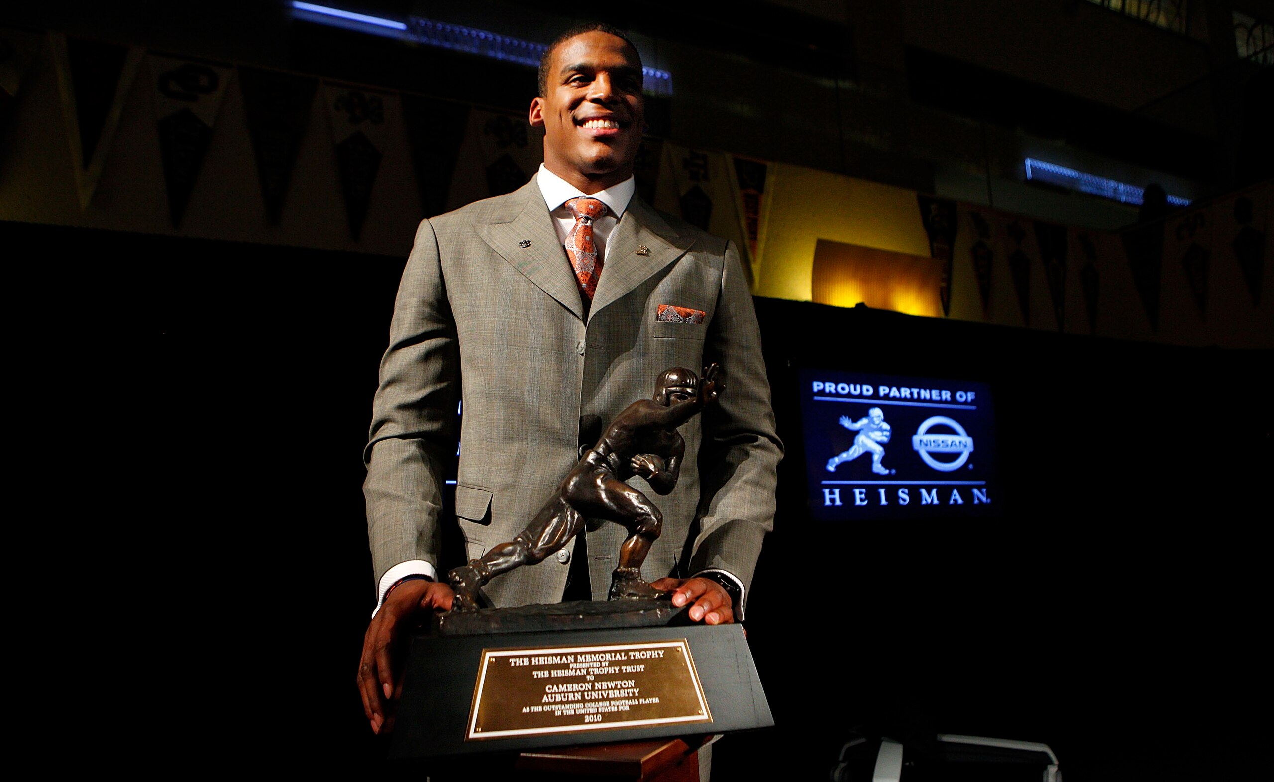 NEW YORK - DECEMBER 11:  Cam Newton, quarterback of the Auburn University Tigers, poses with the 2010 Heisman Memorial Trophy Award on December 11, 2010 in New York City.  (Photo by Jeff Zelevansky/Getty Images)