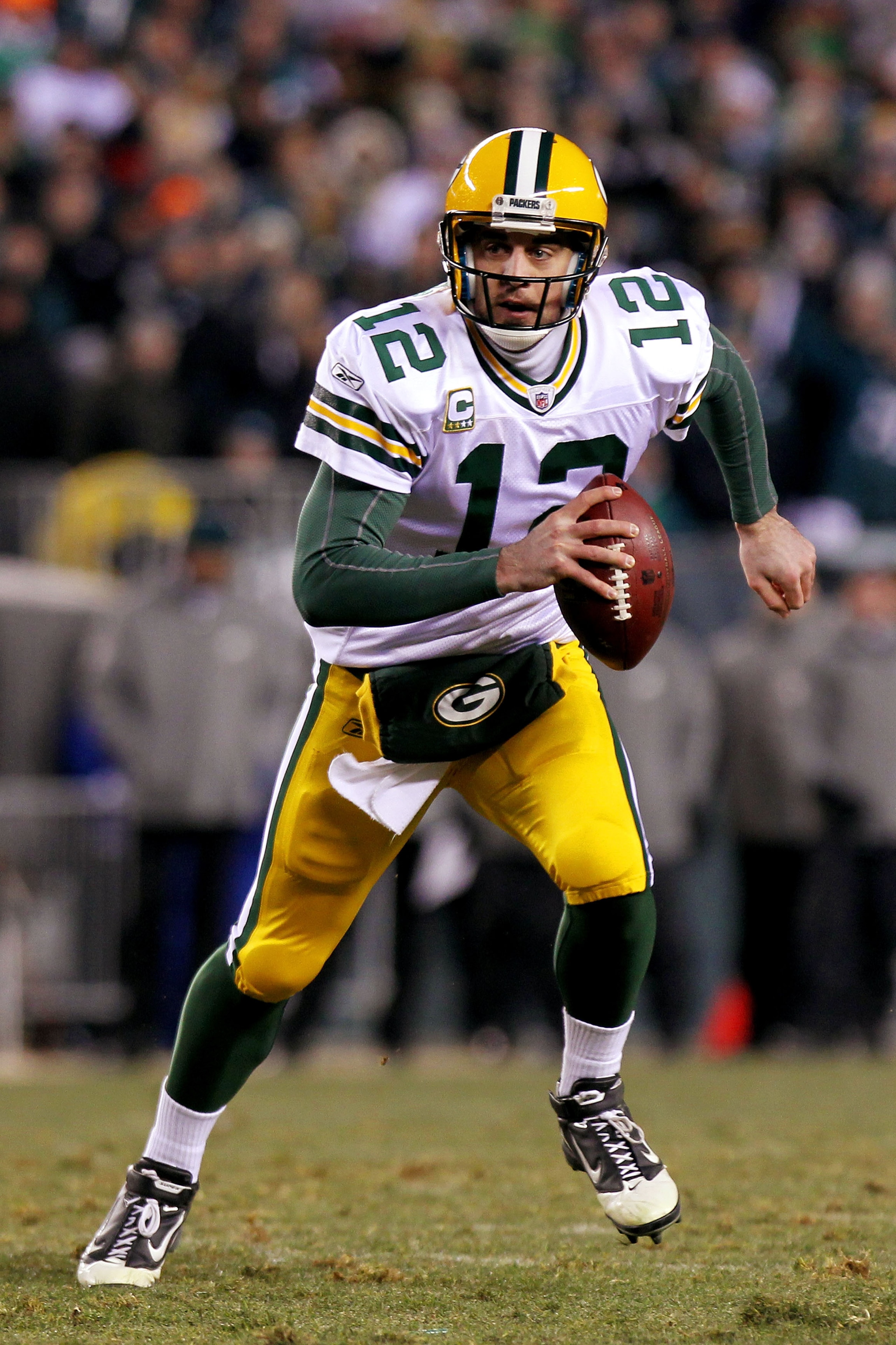 PHILADELPHIA, PA - JANUARY 09: Aaron Rodgers #12 of the Green Bay Packers scrambles with the ball against the Philadelphia Eagles during the 2011 NFC wild card playoff game at Lincoln Financial Field on January 9, 2011 in Philadelphia, Pennsylvania. (Ph PHILADELPHIA, PA - JANUARY 09: Aaron Rodgers #12 of the Green Bay Packers scrambles with the ball against the Philadelphia Eagles during the 2011 NFC wild card playoff game at Lincoln Financial Field on January 9, 2011 in Philadelphia, Pennsylvania. (Ph