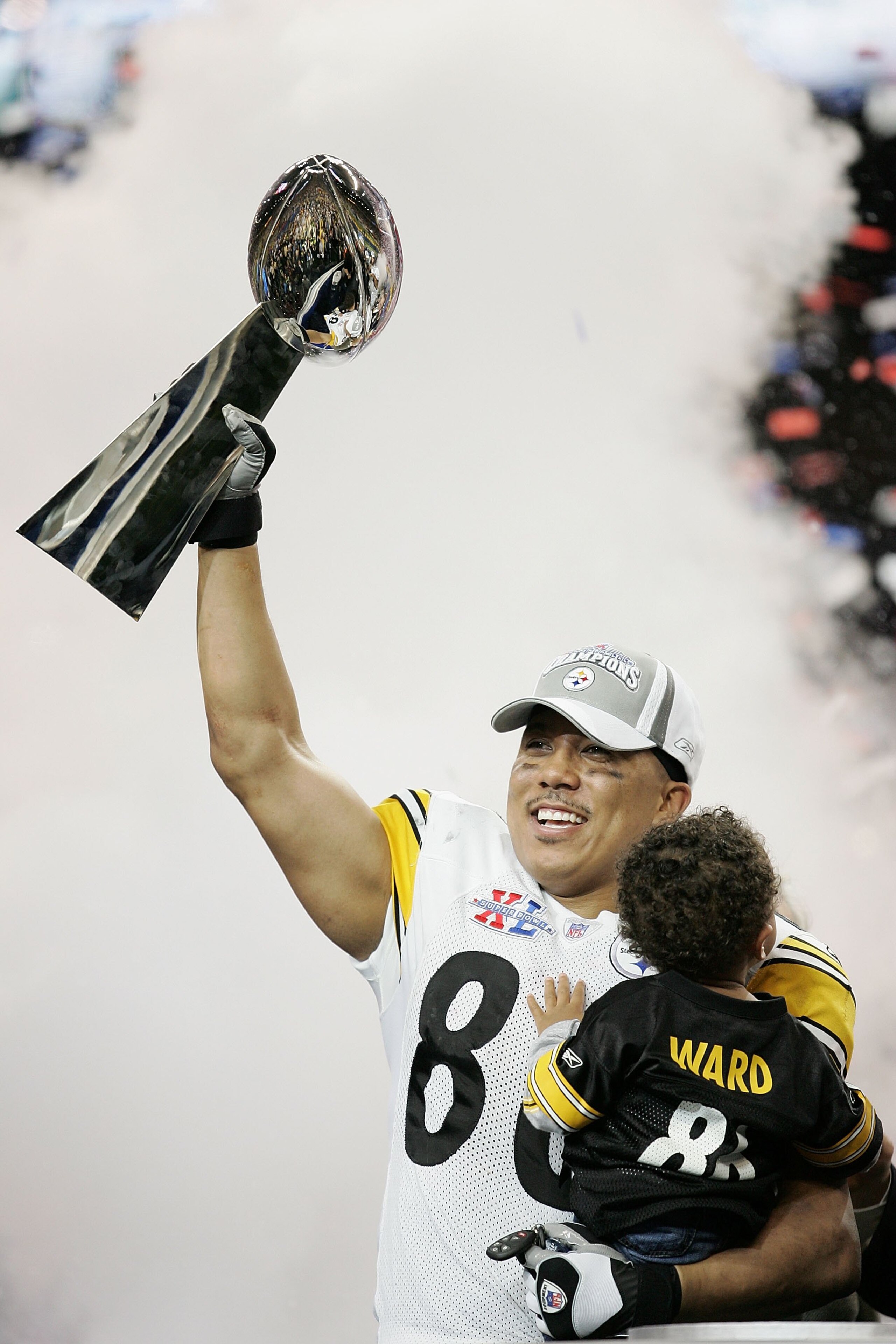 DETROIT - FEBRUARY 05:  Wide receiver Hines Ward #86 of the Pittsburgh Steelers and son Jaden celebrate with the Vince Lombardi Trophy after defeating the Seattle Seahawks in Super Bowl XL at Ford Field on February 5, 2006 in Detroit, Michigan. Bettis ann