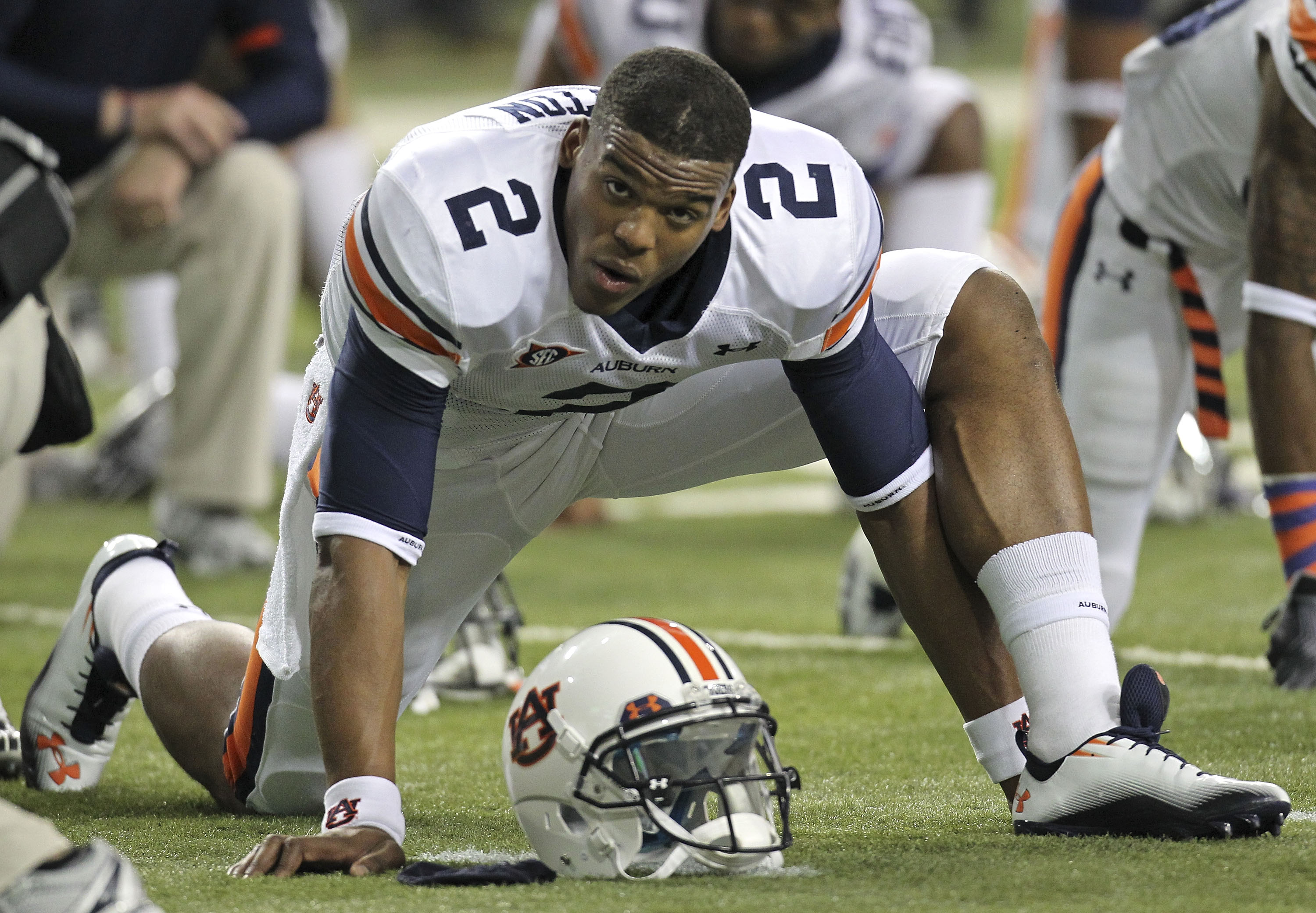 ATLANTA - DECEMBER 04:  Quarterback Cam Newton #2 of the Auburn Tigers stretches before the 2010 SEC Championship against the South Carolina Gamecocks at Georgia Dome on December 4, 2010 in Atlanta, Georgia.  (Photo by Mike Zarrilli/Getty Images)
