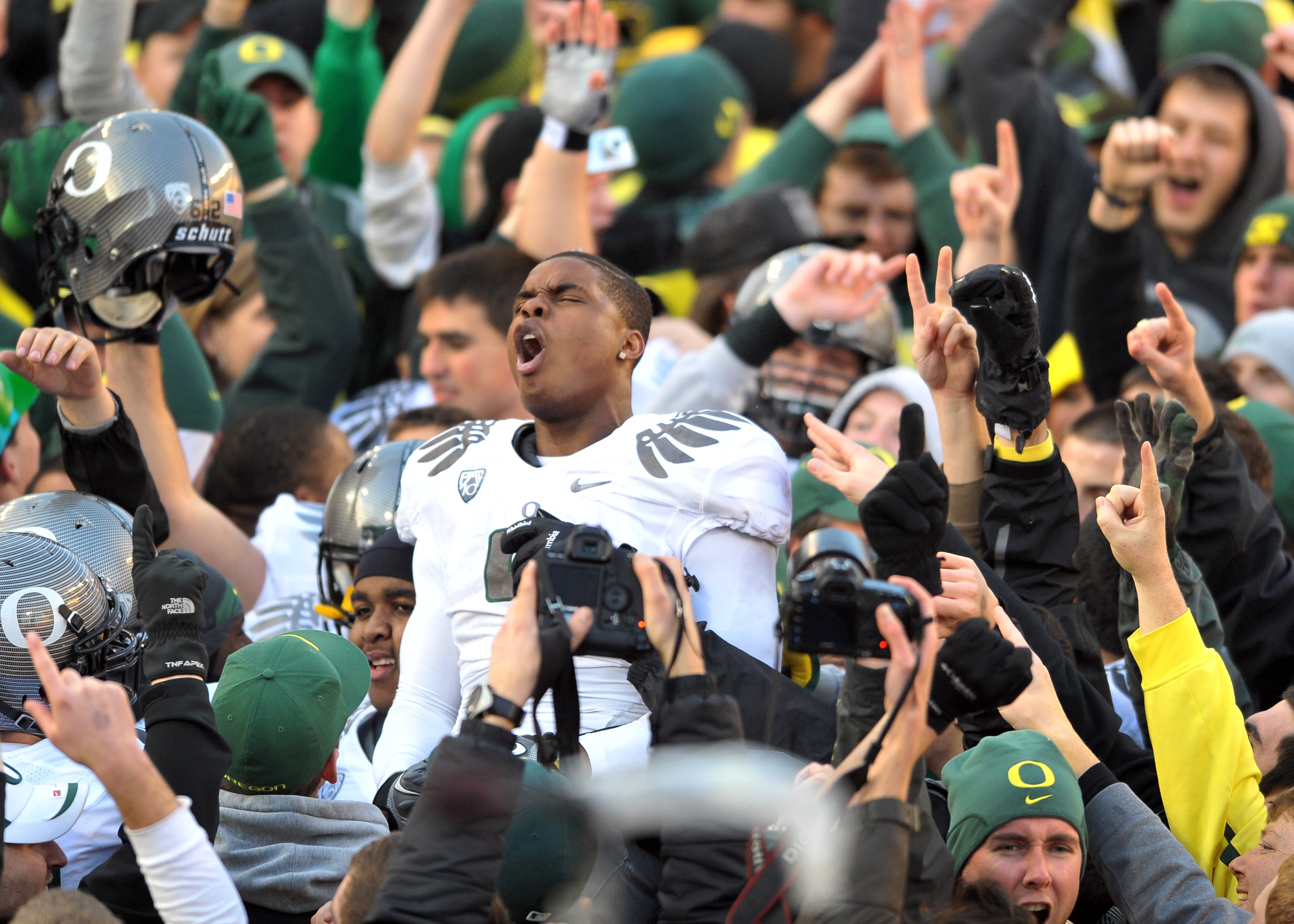 CORVALLIS, OR - DECEMBER 4: Wide receiver Josh Huff #4 of the Oregon Ducks celebrates on the field after the game at Reser Stadium on December 4, 2010 in Corvallis, Oregon. he Ducks beat the Beavers 37-20 to likely go on the BCS Championship game at the T