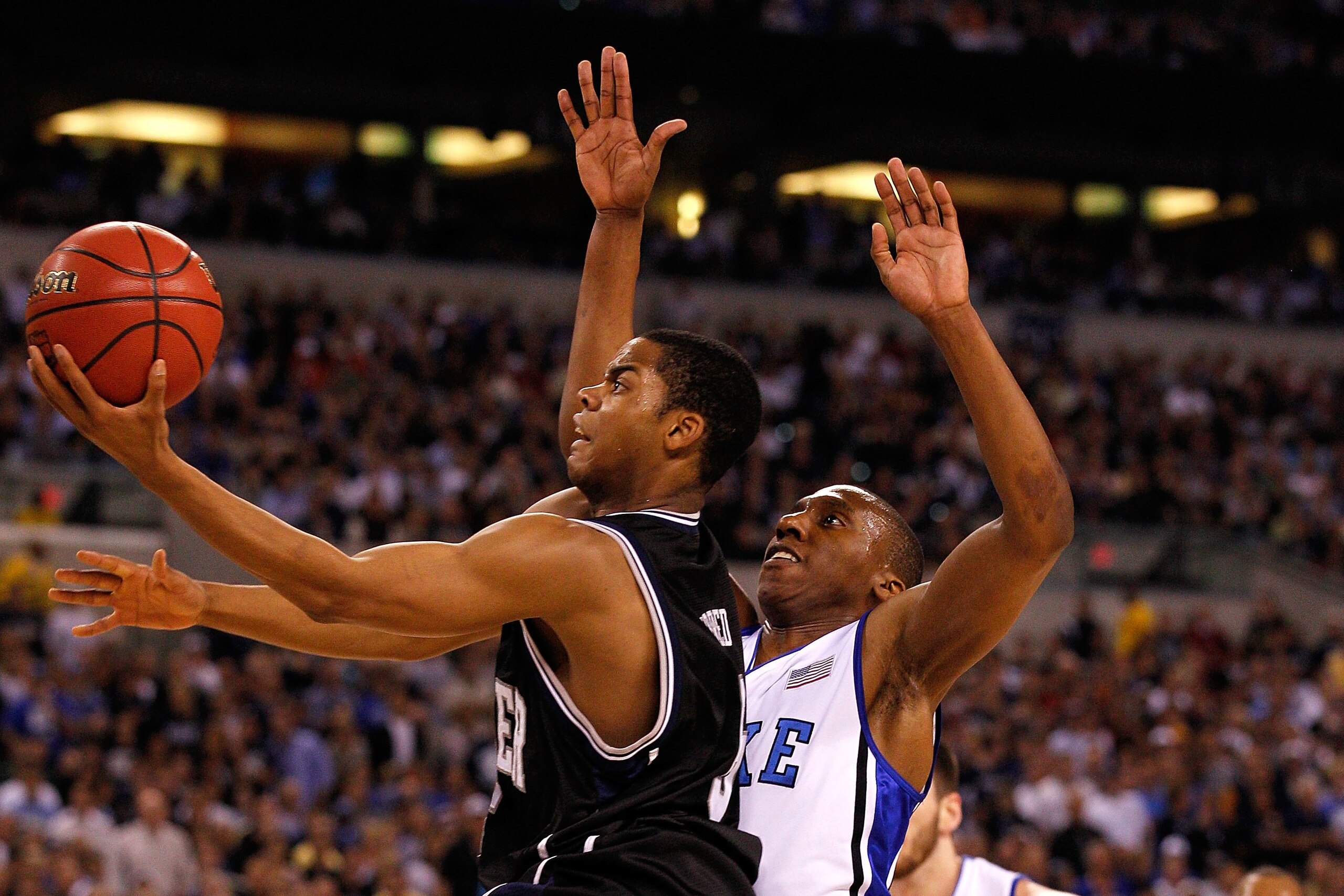 INDIANAPOLIS - APRIL 05:  Ronald Nored #5 of the Butler Bulldogs drives for a shot attempt against Nolan Smith #2 of the Duke Blue Devils during the 2010 NCAA Division I Men's Basketball National Championship game at Lucas Oil Stadium on April 5, 2010 in