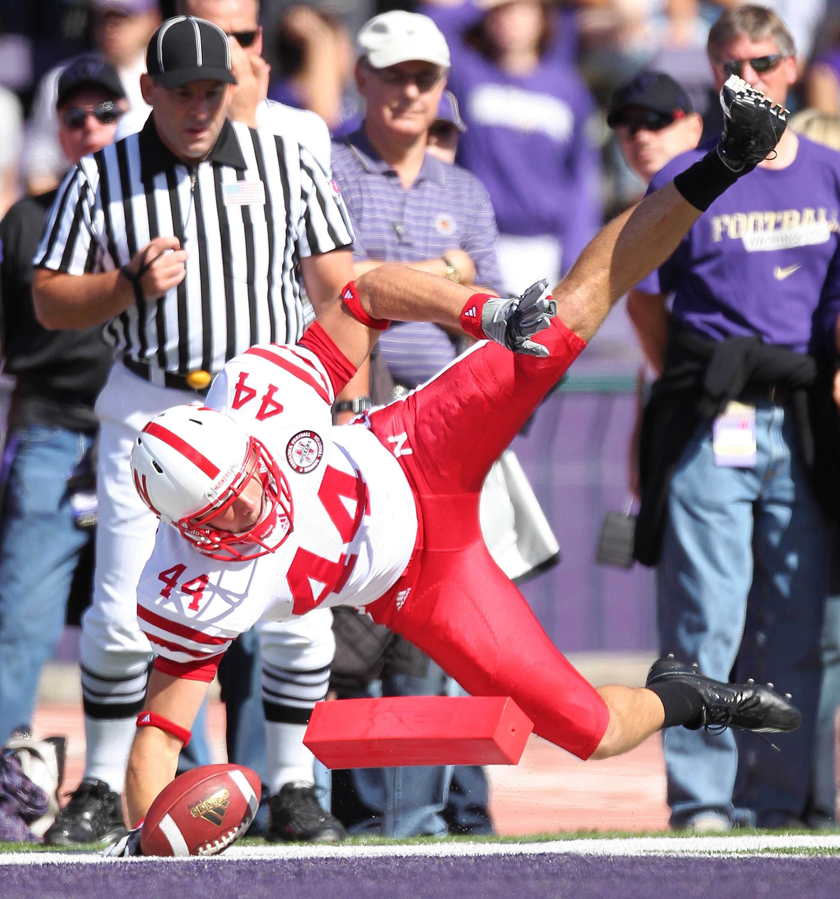 SEATTLE - SEPTEMBER 18:  Tight end Mike McNeill #44 of the Nebraska Cornhuskers scores a touchdown in the first quarter against the Washington Huskies on September 18, 2010 at Husky Stadium in Seattle, Washington. The Cornhuskers defeated the Huskies 56-2