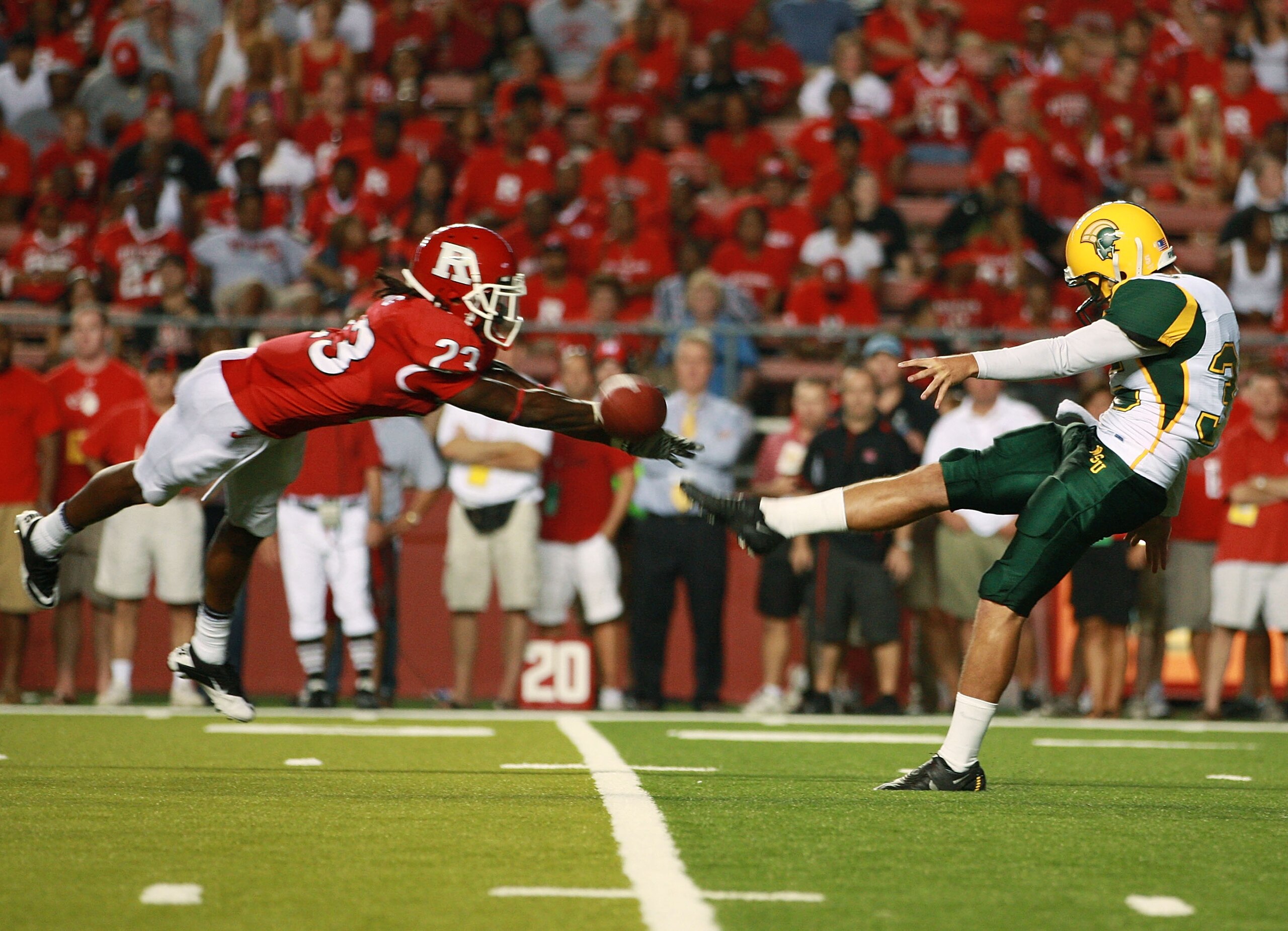 NEW BRUNSWICK, NJ - SEPTEMBER 02: Brandon Bing #23 of the Rutgers Scarlet Knights successfully blocks a punt from Troy Muenzer #35 of the Norfolk State Spartans at Rutgers Stadium on September 2, 2010 in New Brunswick, New Jersey. The punt was recovered NEW BRUNSWICK, NJ - SEPTEMBER 02: Brandon Bing #23 of the Rutgers Scarlet Knights successfully blocks a punt from Troy Muenzer #35 of the Norfolk State Spartans at Rutgers Stadium on September 2, 2010 in New Brunswick, New Jersey. The punt was recovered