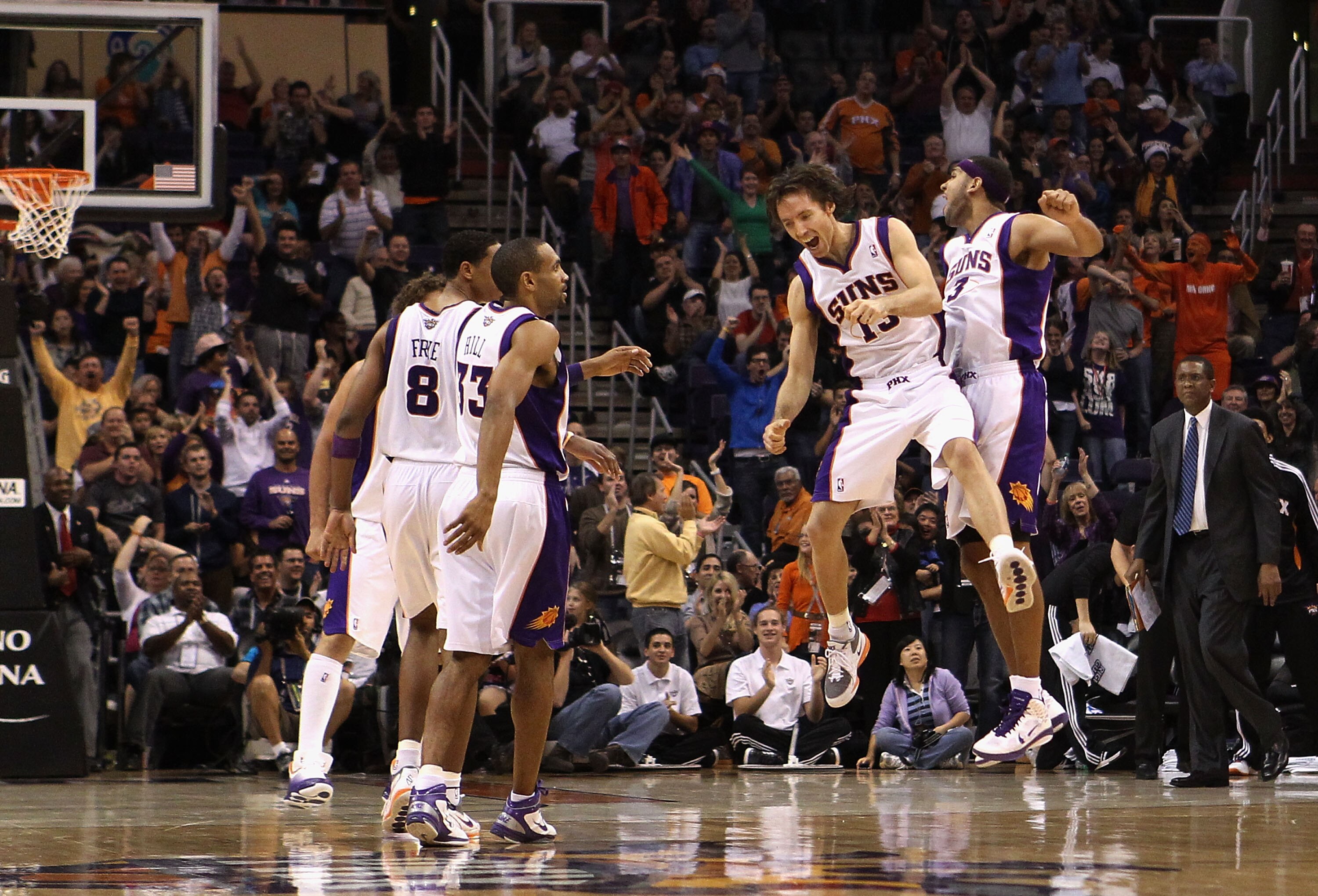 PHOENIX - DECEMBER 15:  Steve Nash #13 and Jared Dudley #3 of the Phoenix Suns celebrate after hitting a three point shot against the Minnesota Timberwolves during the NBA game at US Airways Center on December 15, 2010 in Phoenix, Arizona. The Suns defeat