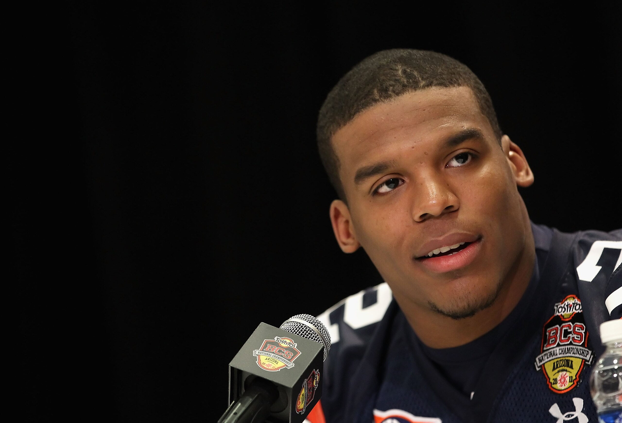SCOTTSDALE, AZ - JANUARY 07: Quarterback Cam Newton #2 of the Auburn Tigers speaks during Media Day for the Tostitos BCS National Championship Game at the JW Marriott Camelback Inn on January 7, 2011 in Scottsdale, Arizona. (Photo by Christian Petersen/ SCOTTSDALE, AZ - JANUARY 07: Quarterback Cam Newton #2 of the Auburn Tigers speaks during Media Day for the Tostitos BCS National Championship Game at the JW Marriott Camelback Inn on January 7, 2011 in Scottsdale, Arizona. (Photo by Christian Petersen/
