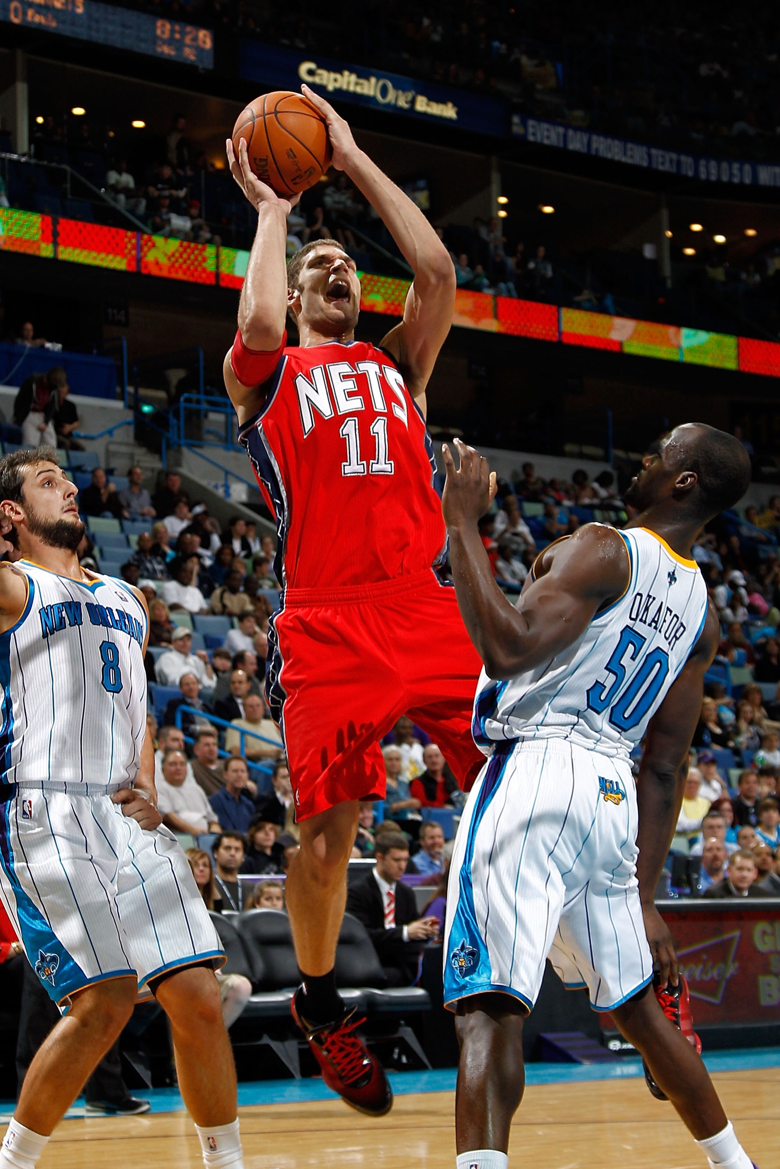 NEW ORLEANS, LA - DECEMBER 22: Brook Lopez #11 of the New Jersey Nets shoots the ball over Emeka Okafor #50 of the New Orleans Hornets at the New Orleans Arena on December 22, 2010 in New Orleans, Louisiana. The Hornets defeated the Nets 105-91. NOT NEW ORLEANS, LA - DECEMBER 22: Brook Lopez #11 of the New Jersey Nets shoots the ball over Emeka Okafor #50 of the New Orleans Hornets at the New Orleans Arena on December 22, 2010 in New Orleans, Louisiana. The Hornets defeated the Nets 105-91. NOT