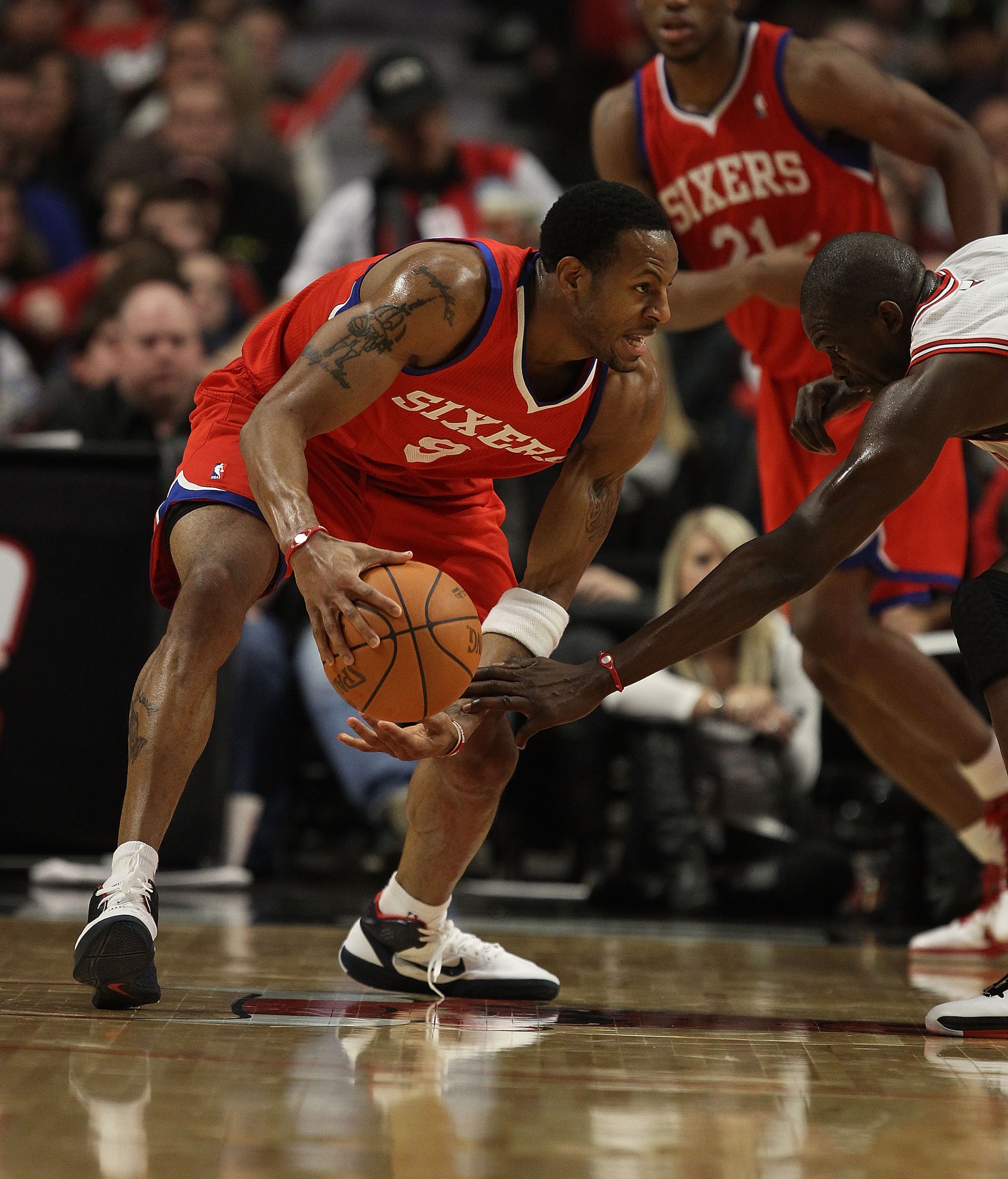 CHICAGO, IL - DECEMBER 21: Andre Iguodala #9 of the Philadelphia 76ers tries to move against Loul Deng #9 of the Chicago Bulls at the United Center on December 21, 2010 in Chicago, Illinois. The Bulls defeated the 76ers 121-76. NOTE TO USER: User expressl CHICAGO, IL - DECEMBER 21: Andre Iguodala #9 of the Philadelphia 76ers tries to move against Loul Deng #9 of the Chicago Bulls at the United Center on December 21, 2010 in Chicago, Illinois. The Bulls defeated the 76ers 121-76. NOTE TO USER: User expressl