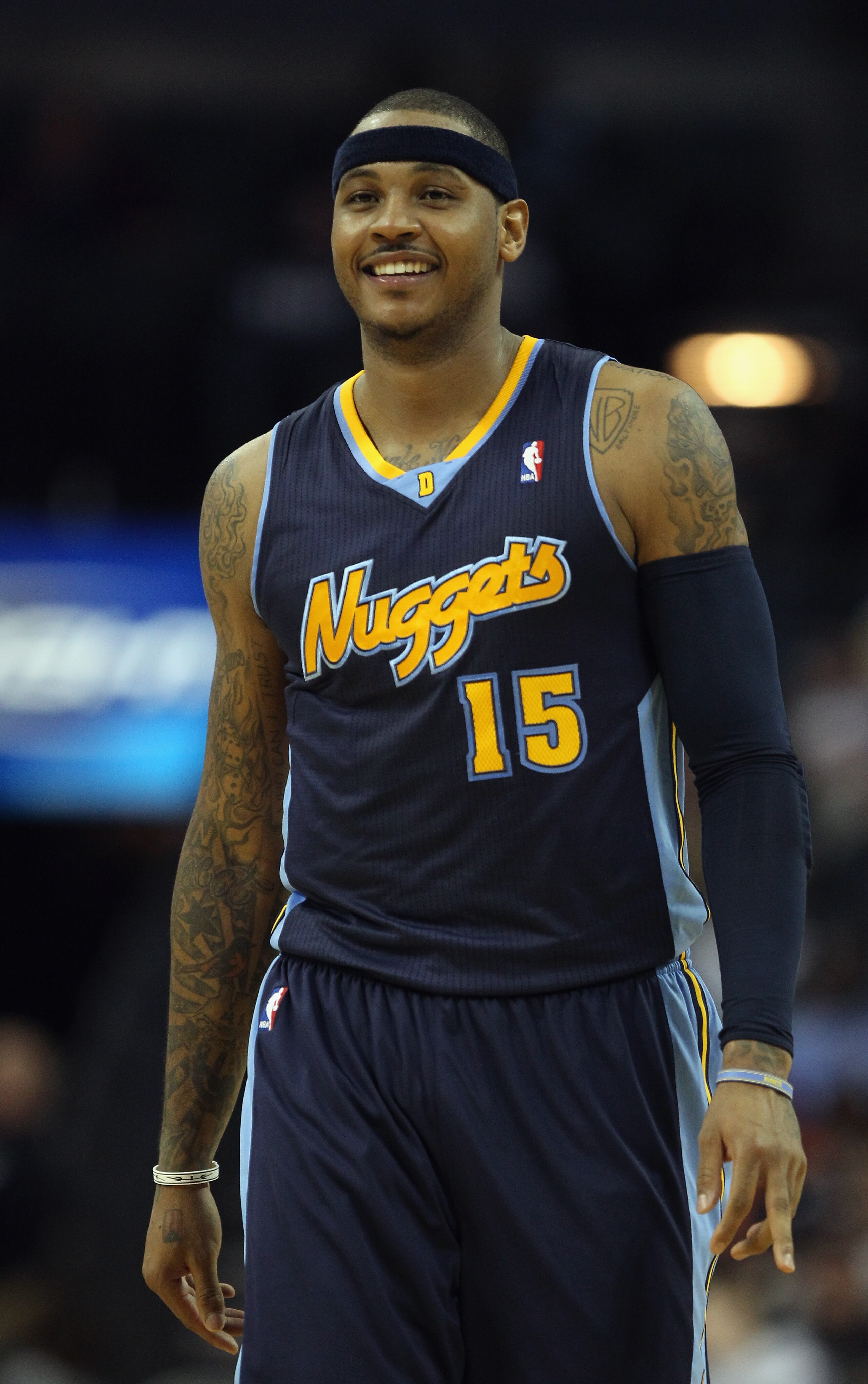 CHARLOTTE, NC - DECEMBER 07: Carmelo Anthony #15 of the Denver Nuggets watches on against the Charlotte Bobcats during their game at Time Warner Cable Arena on December 7, 2010 in Charlotte, North Carolina. NOTE TO USER: User expressly acknowledges and CHARLOTTE, NC - DECEMBER 07: Carmelo Anthony #15 of the Denver Nuggets watches on against the Charlotte Bobcats during their game at Time Warner Cable Arena on December 7, 2010 in Charlotte, North Carolina. NOTE TO USER: User expressly acknowledges and