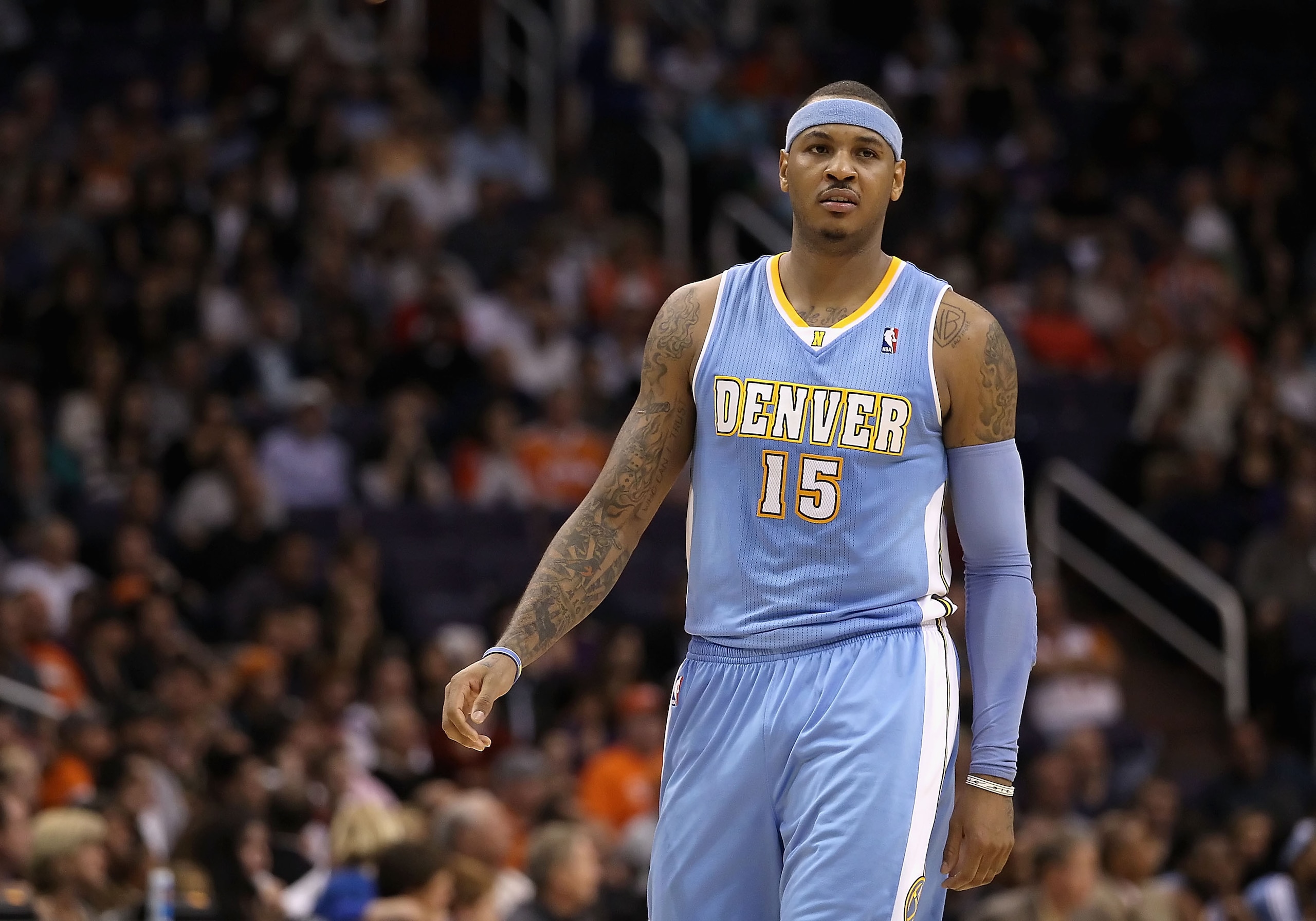 PHOENIX - NOVEMBER 15: Carmelo Anthony #15 of the Denver Nuggets during the NBA game against the Phoenix Suns at US Airways Center on November 15, 2010 in Phoenix, Arizona. The Suns defeated the Nuggets 100-94. NOTE TO USER: User expressly acknowledges PHOENIX - NOVEMBER 15: Carmelo Anthony #15 of the Denver Nuggets during the NBA game against the Phoenix Suns at US Airways Center on November 15, 2010 in Phoenix, Arizona. The Suns defeated the Nuggets 100-94. NOTE TO USER: User expressly acknowledges