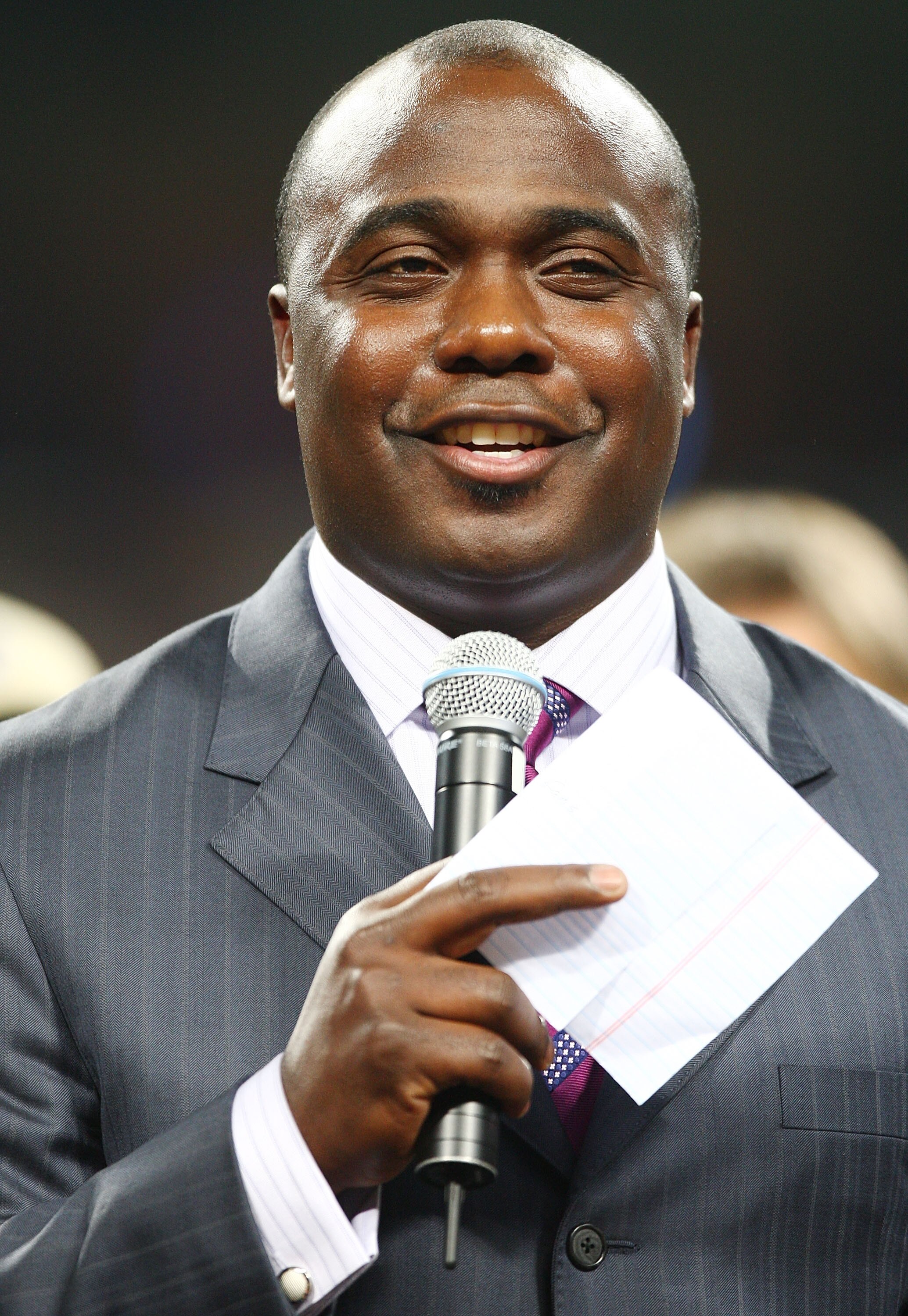 ST. LOUIS - DECEMBER 20:  Former running back Marshall Faulk of the St. Louis Rams addresses the fans during a halftime ceremony to retire his jersey on December 20, 2007 at Edward Jones Dome in St. Louis, Missouri.  (Photo by Elsa/Getty Images)
