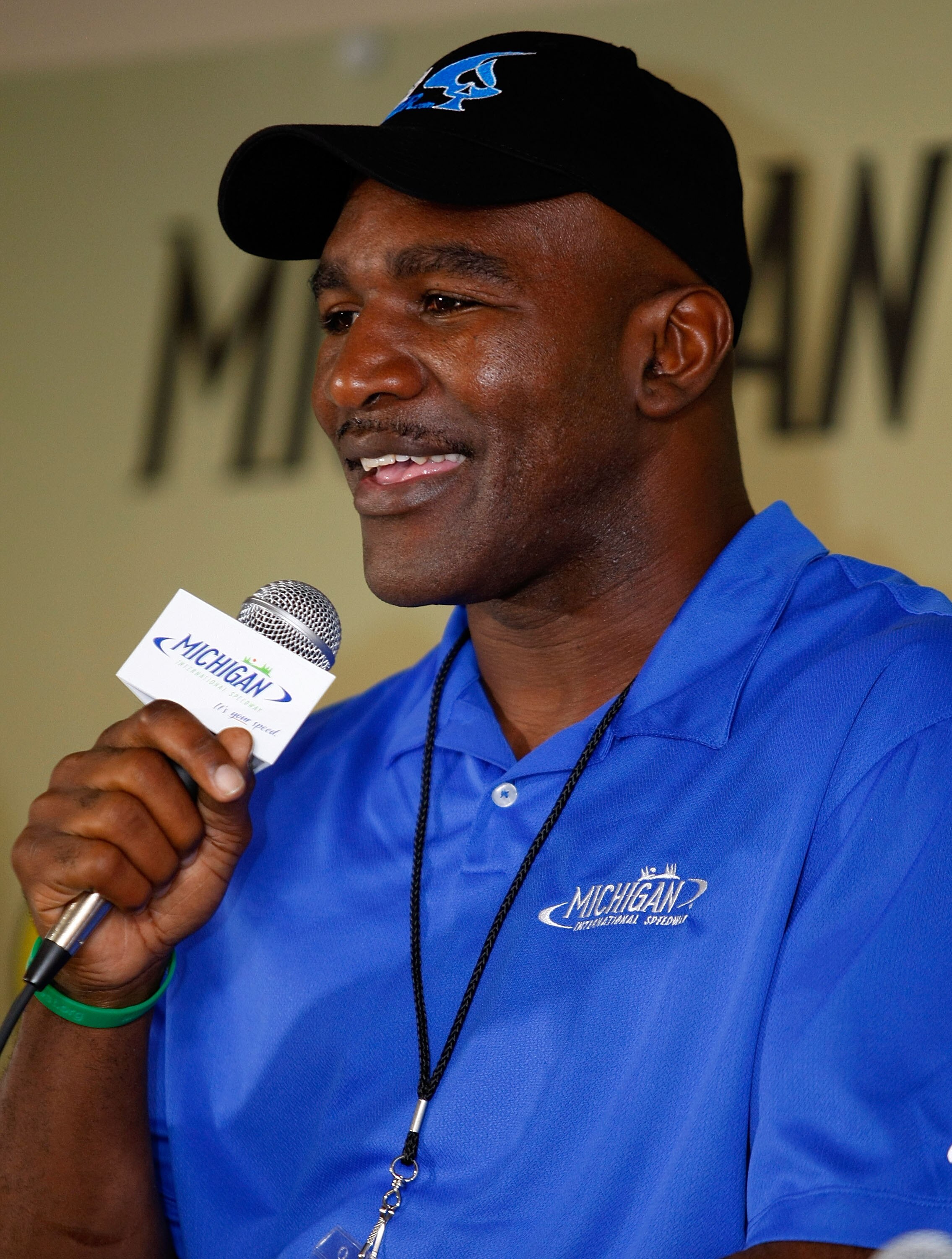 BROOKLYN, MI - AUGUST 15:  Former heavyweight Champion Evander Holyfield speaks at a press conference prior to the NASCAR Sprint Cup Series CARFAX 400 at Michigan International Speedway on August 15, 2010 in Brooklyn, Michigan. Holyfield is the co-Grand M