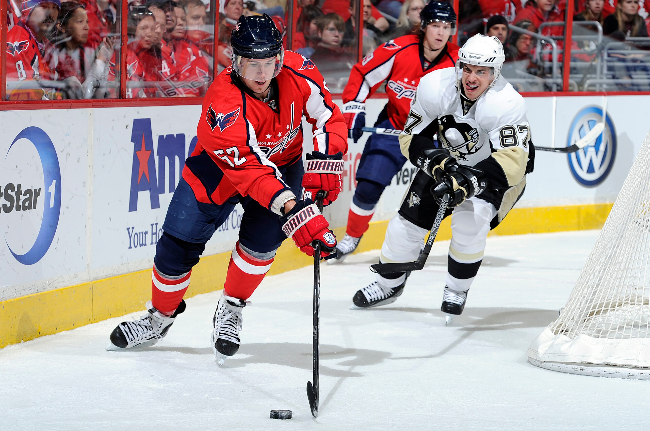 WASHINGTON, DC - DECEMBER 23:  Mike Green #52 of the Washington Capitals battles for the puck against Sidney Crosby #87 of the Pittsburgh Penguins at the Verizon Center on December 23, 2010 in Washington DC.  (Photo by Greg Fiume/Getty Images)