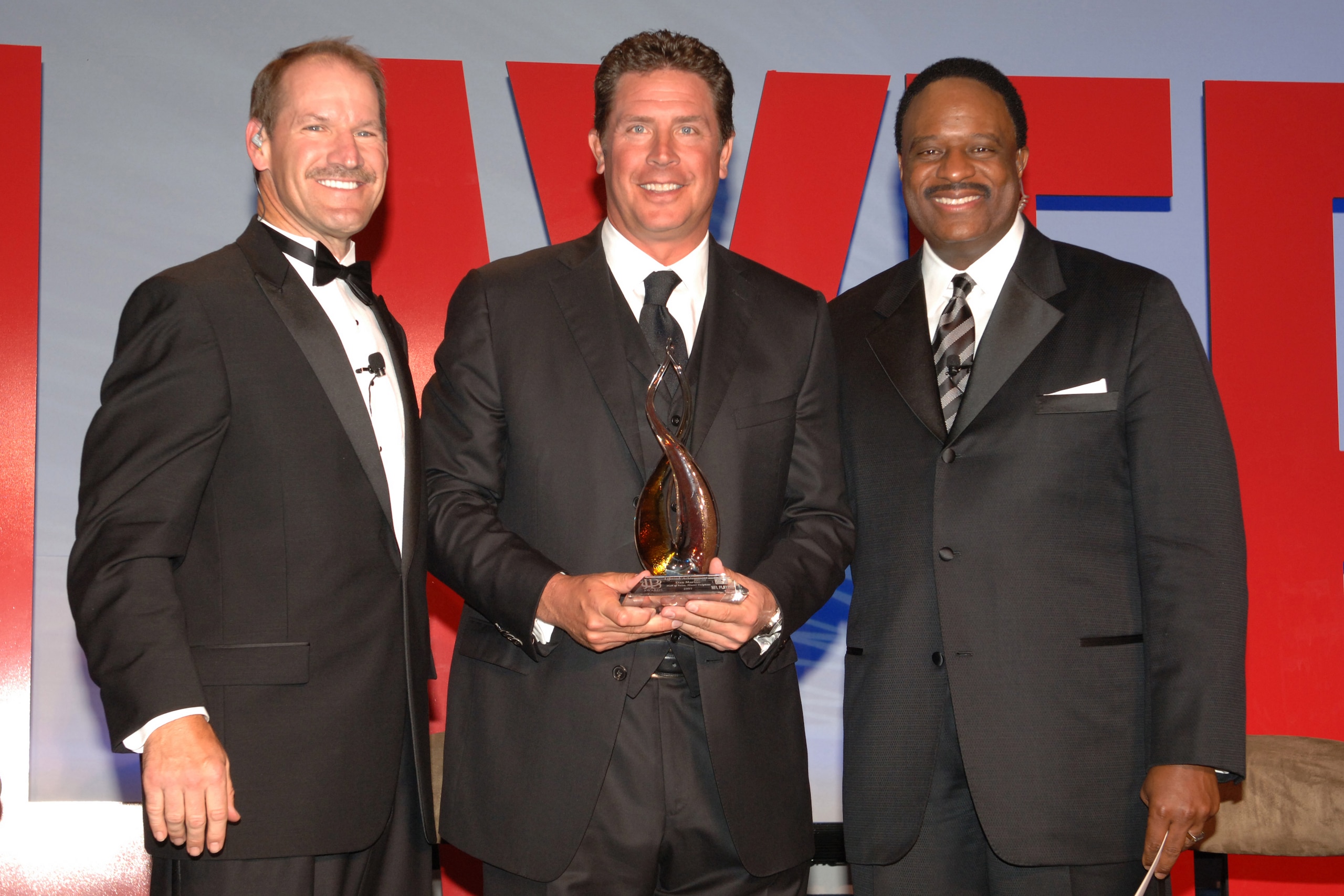 WASHINGTON - APRIL 4: Hall of Famer Dan Marino (C) accepts the JB Award for Lifetime Acheivement from co-hosts Bill Cowher and James Brown (R) during the NFL Players Gala at the Washington Hilton on April 4, 2008 in Washington, D.C. (Photo by Mitchell WASHINGTON - APRIL 4: Hall of Famer Dan Marino (C) accepts the JB Award for Lifetime Acheivement from co-hosts Bill Cowher and James Brown (R) during the NFL Players Gala at the Washington Hilton on April 4, 2008 in Washington, D.C. (Photo by Mitchell