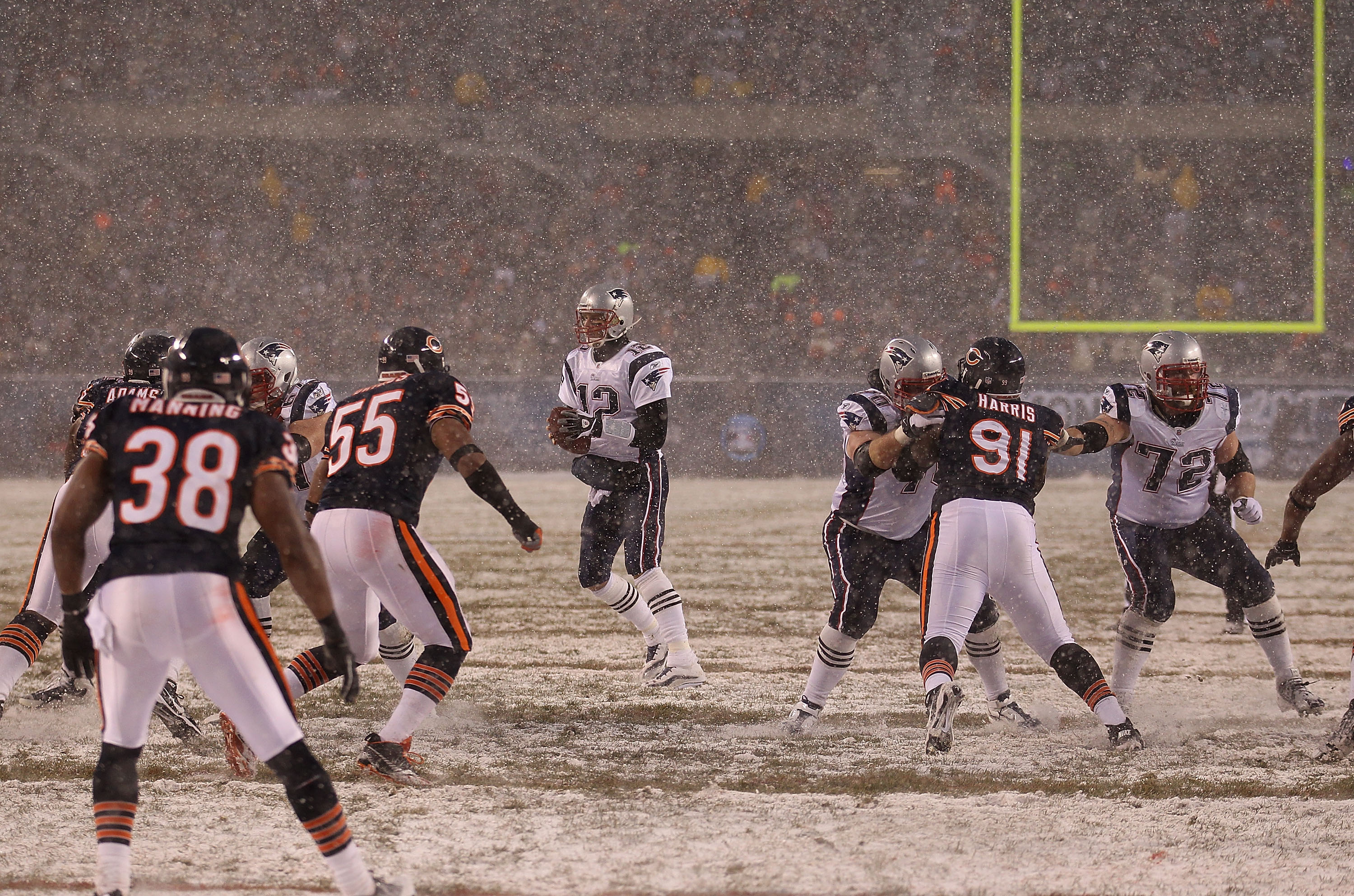 CHICAGO, IL - DECEMBER 12: Tom Brady #12 of the New England Patriots looks for a receiver against the Chicago Bears at Soldier Field on December 12, 2010 in Chicago, Illinois. The Patriots defeated the Bears 36-7. (Photo by Jonathan Daniel/Getty Images)