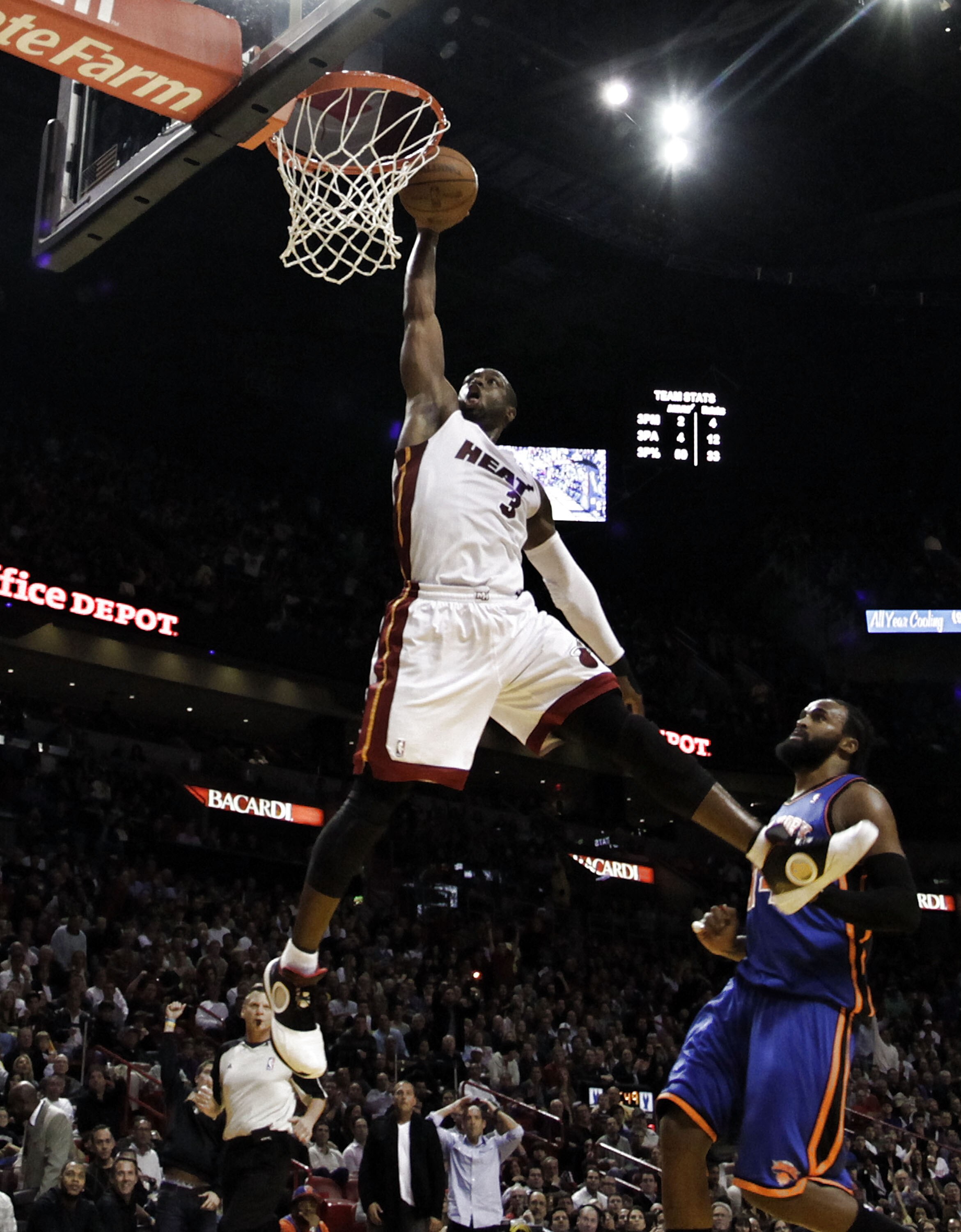MIAMI - DECEMBER 28: Dwyane Wade #3 of the Miami Heat dunks against the New York Knicks at American Airlines Arena on December 28, 2010 in Miami, Florida. Wade had 40 points as the Heat defeated the Knicks 106-98.  NOTE TO USER: User expressly acknowledge