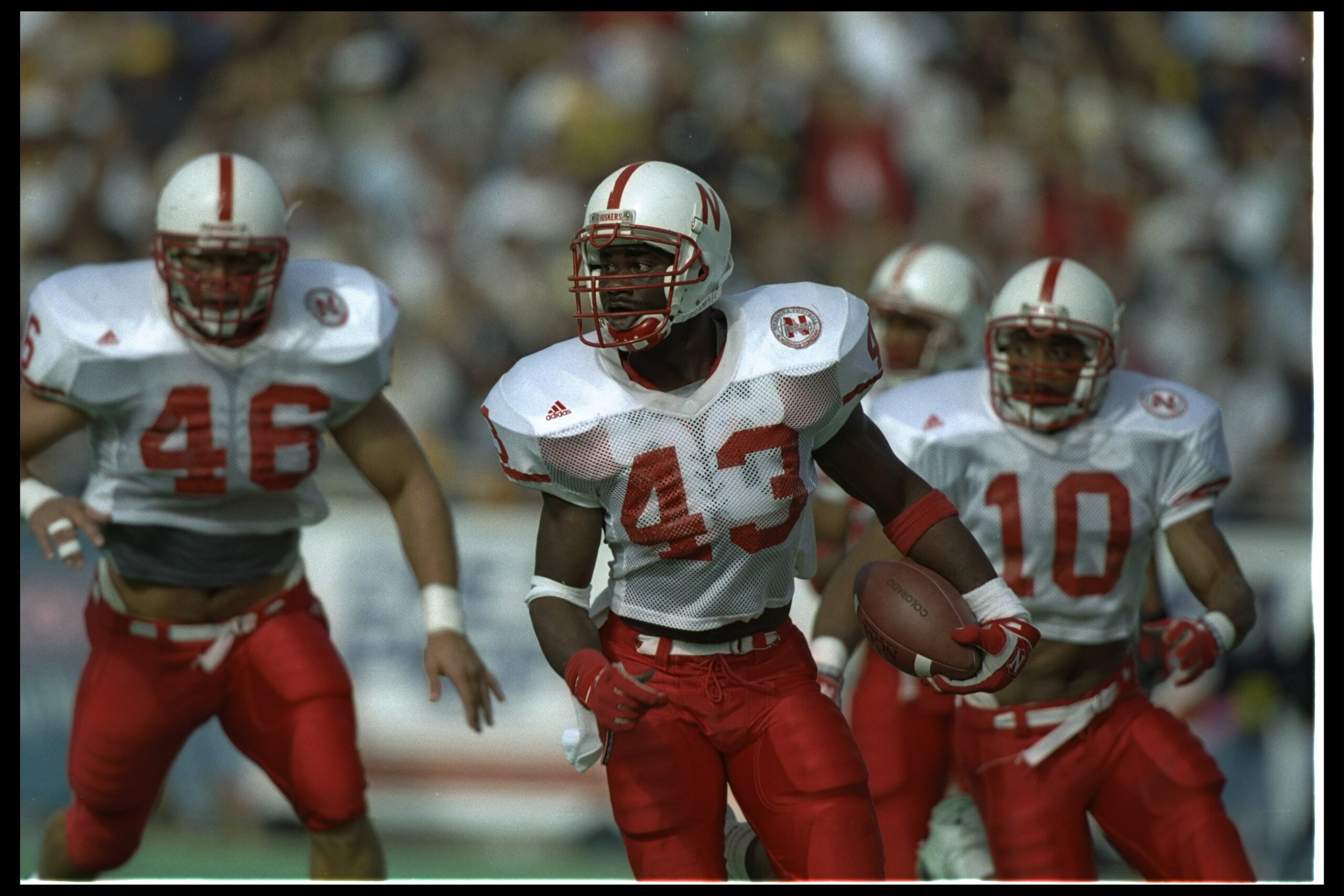 28 Oct 1995: Nebraska Cornhuskers players Terrell Farley #43, Mike Minier #10, and Doug Colman #46 celebrate during a game against the Colorado Buffaloes at Folsom Field in Boulder, Colorado. Nebraska won the game, 44-21.