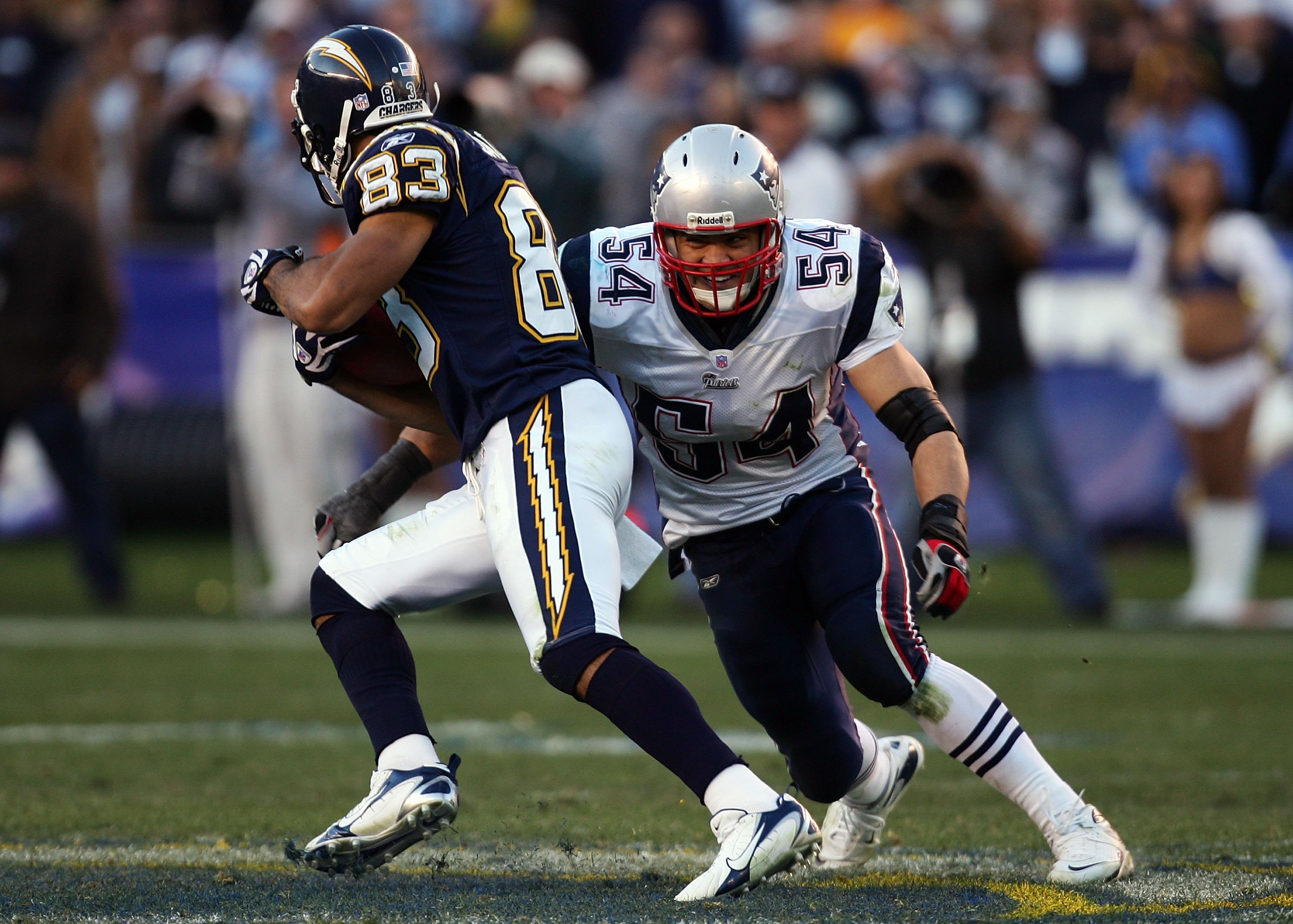 SAN DIEGO - JANUARY 14:  Linebacker Tedy Bruschi #54 of the New England Patriots looks to tackle wide receiver Vincent Jackson #83 of the San Diego Chargers during the AFC Divisional Playoff Game held on January 14, 2007 at Qualcomm Stadium in San Diego, 