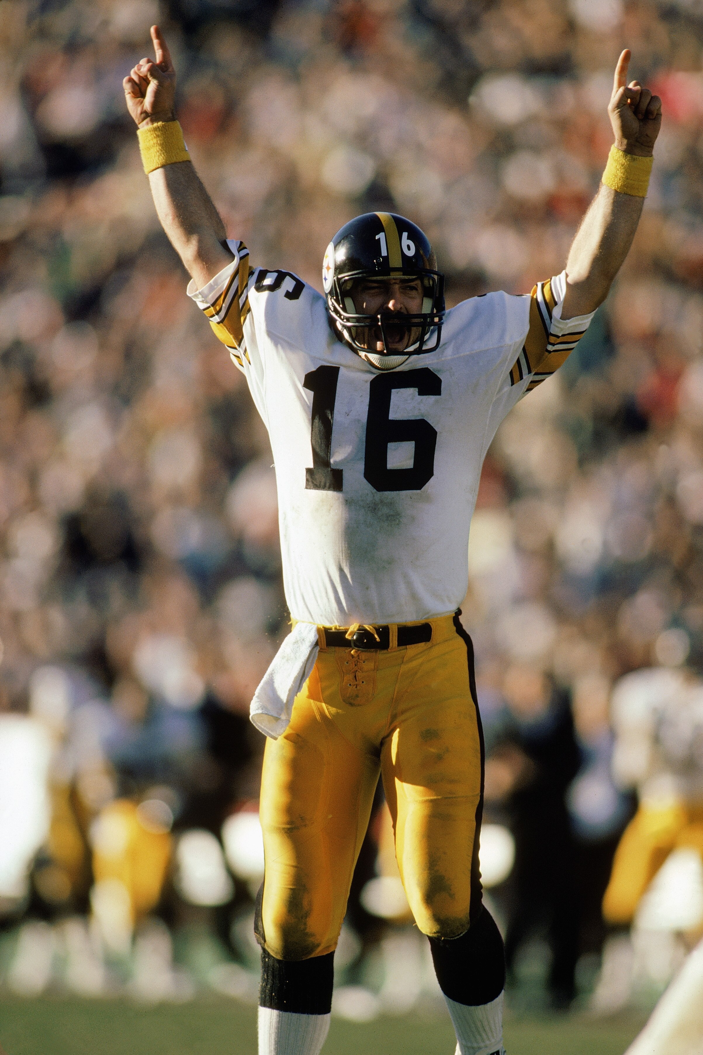 1984:  Quarterback Mark Malone #16 of the Pittsburgh Steelers celebrates during a 1984 NFL game.  (Photo by Rick Stewart/Getty Images)