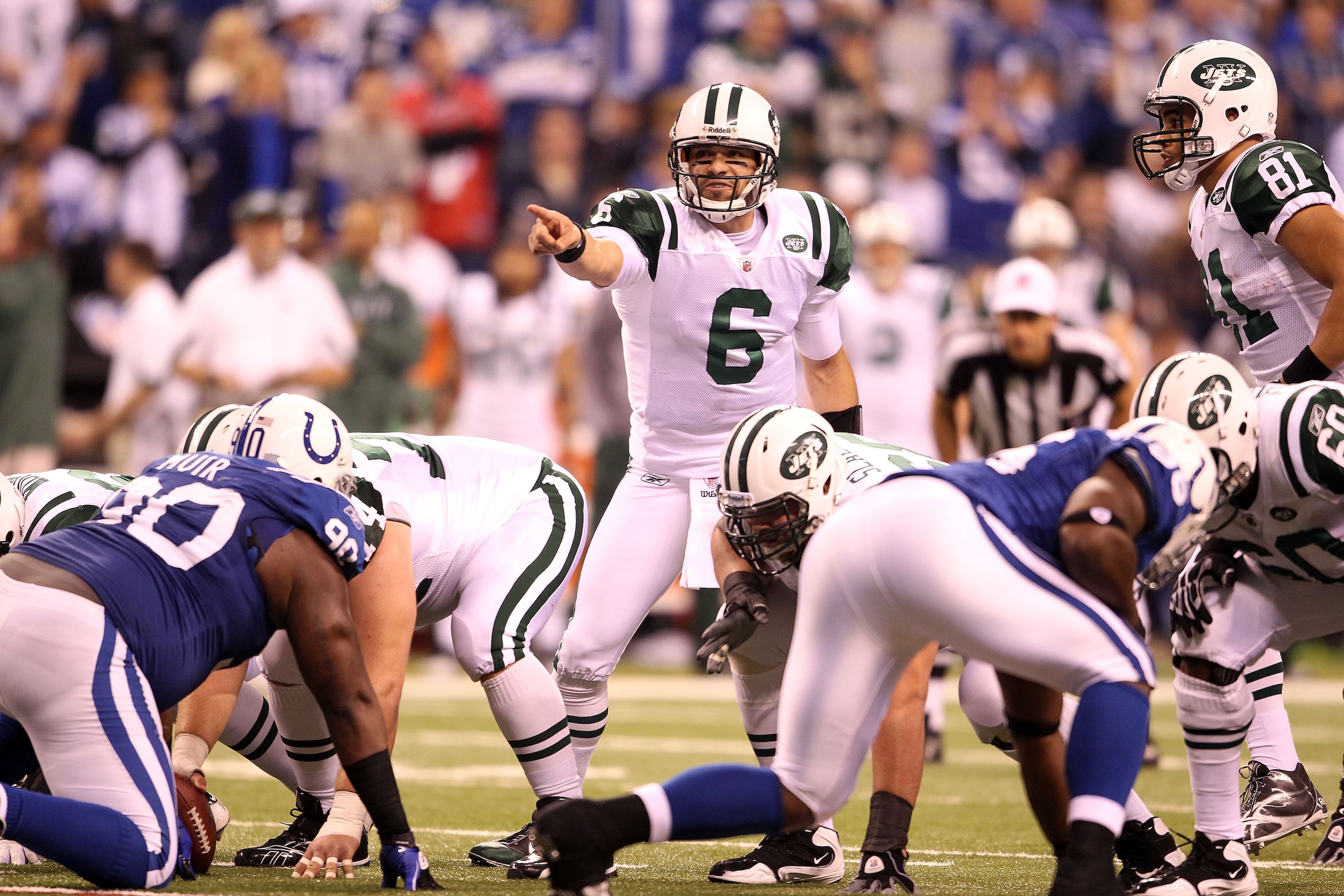 INDIANAPOLIS, IN - JANUARY 08:  Mark Sanchez #6 of the New York Jets gestures at the line of scrimmage against the Indianapolis Colts during their 2011 AFC wild card playoff game at Lucas Oil Stadium on January 8, 2011 in Indianapolis, Indiana. The Jets w