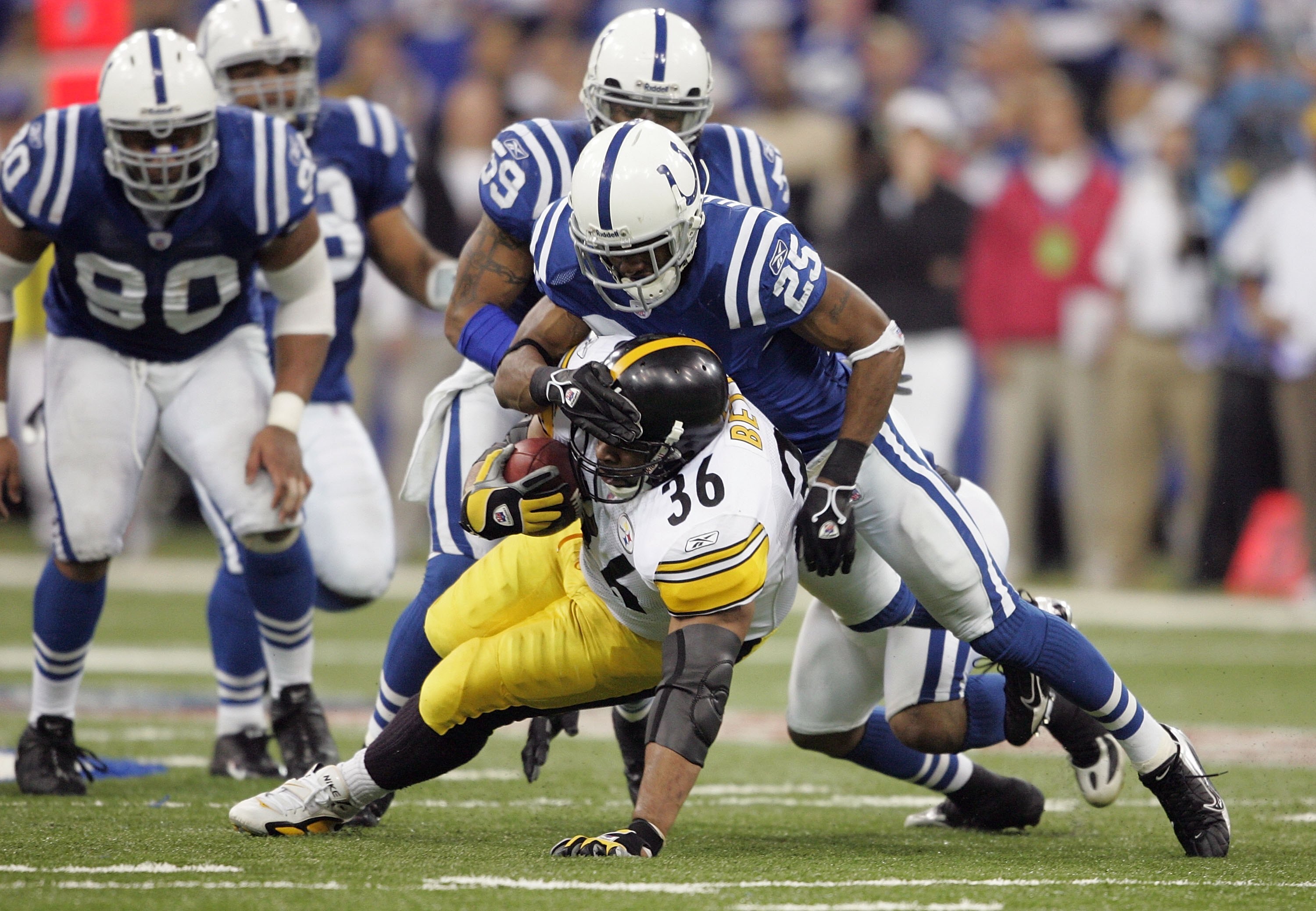 INDIANAPOLIS - JANUARY 15:  Nick Harper #25 of the Inidanapolis Colts tackles Jerome Bettis #36 of the Pittsburgh Steelers during the AFC Divisional Playoffs January 15, 2006 at the RCA Dome in Indianapolis, Indiana. The Steelers won 21-18. Harper was cut