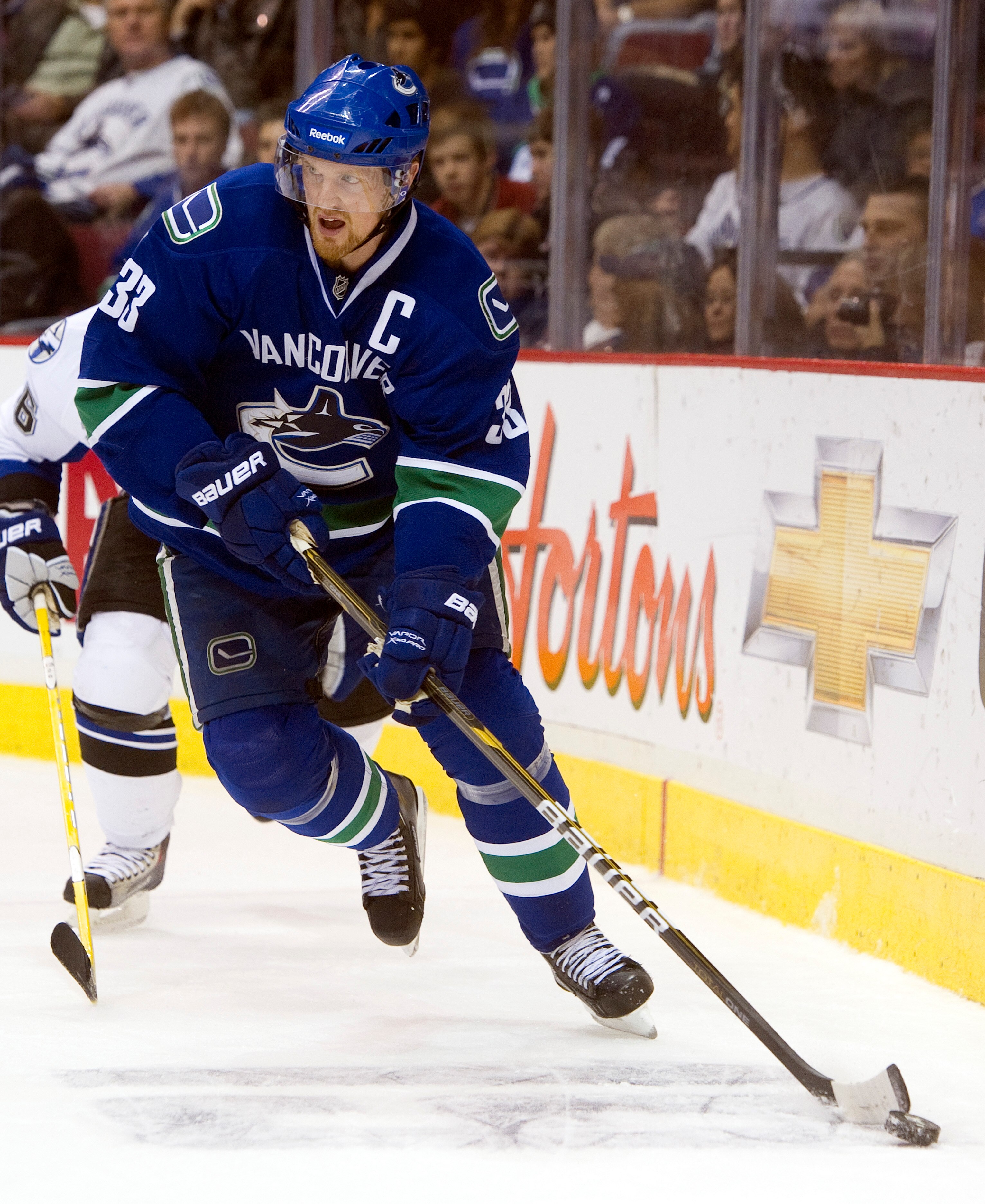 VANCOUVER, CANADA - DECEMBER 11: Henrik Sedin #33 of the Vancouver Canucks skates with the puck during NHL action on December 11, 2010 against the Tampa Bay Lightning at Rogers Arena in Vancouver, BC, Canada.  (Photo by Rich Lam/Getty Images)