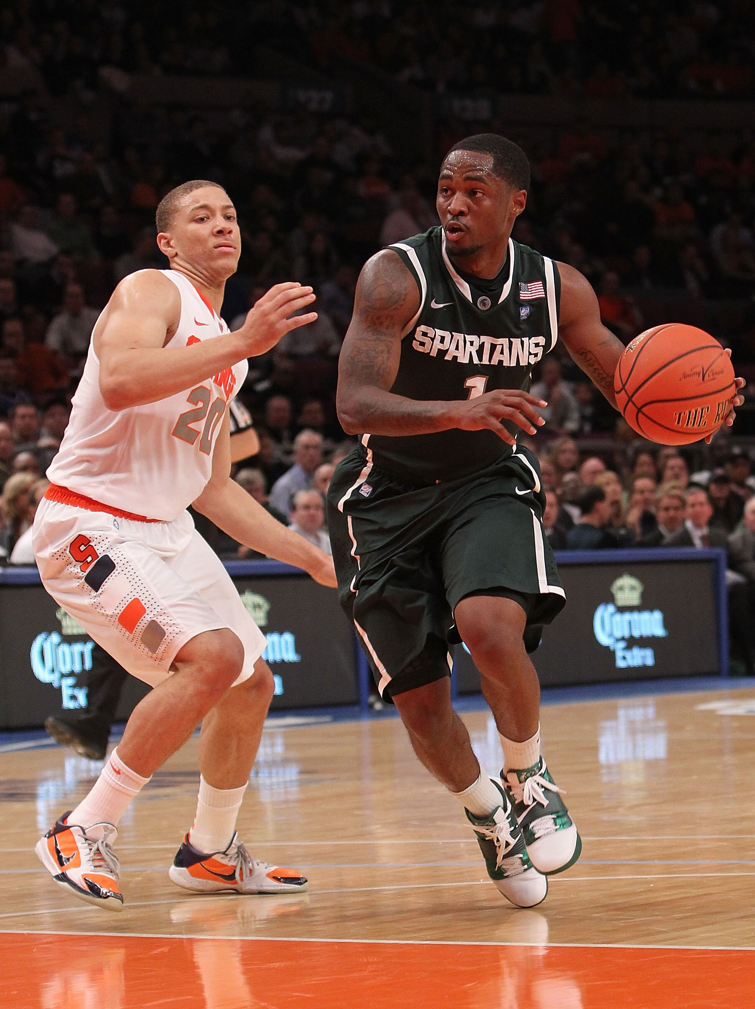 NEW YORK, NY - DECEMBER 07: Kalin Lucas #1 of the Michigan Spartans drives to the basket alongside Brandon Triche #20 of the Syracuse Orange during their game at the Jimmy V Classic at Madison Square Garden on December 7, 2010 in New York City. (Photo b NEW YORK, NY - DECEMBER 07: Kalin Lucas #1 of the Michigan Spartans drives to the basket alongside Brandon Triche #20 of the Syracuse Orange during their game at the Jimmy V Classic at Madison Square Garden on December 7, 2010 in New York City. (Photo b