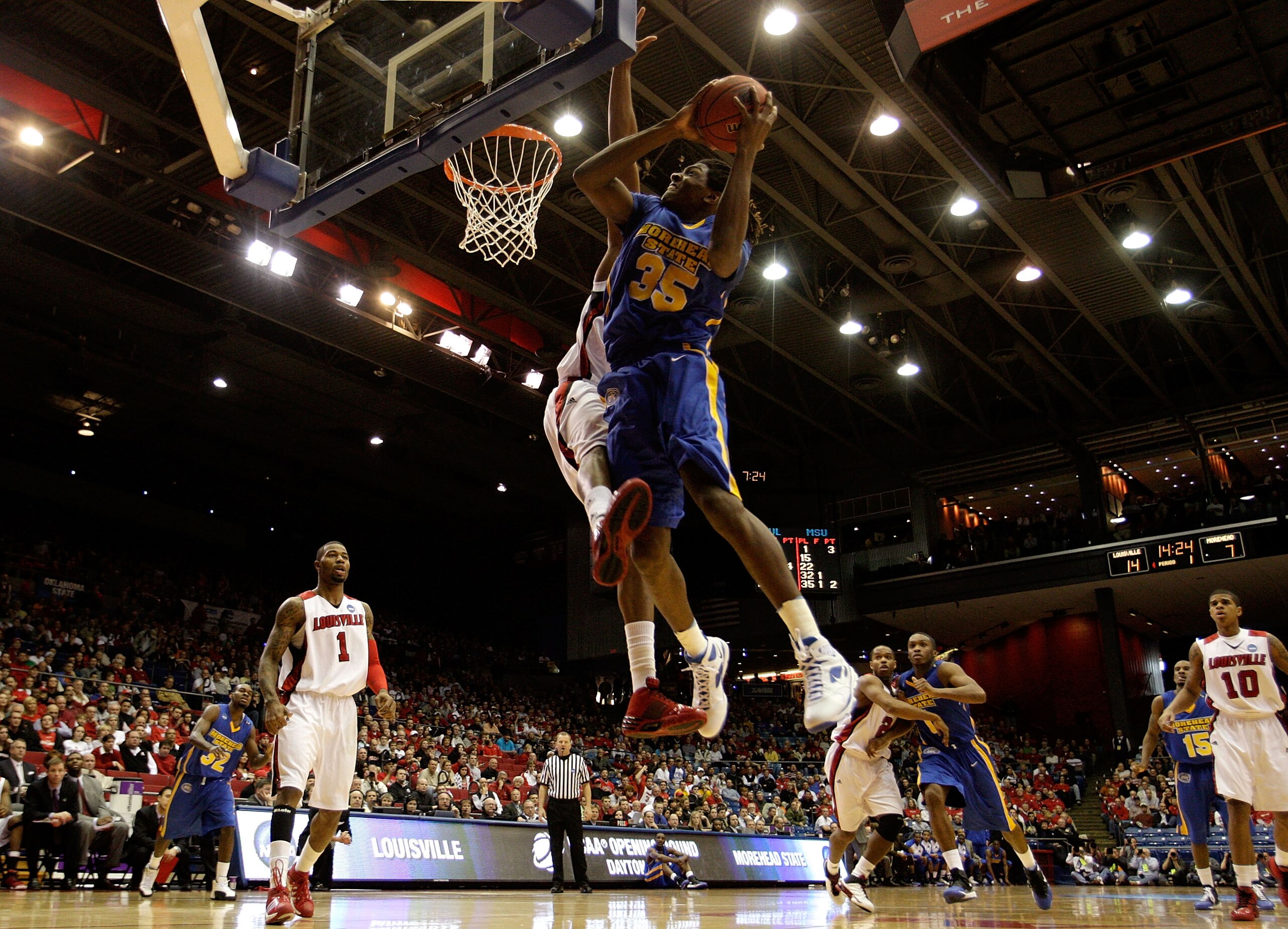 DAYTON, OH - MARCH 20: Kenneth Faried #35 of the Morehead State Eagles drives to the hoop against George Goode #22 of the Louisville Cardinals during the first round of the NCAA Division I Men's Basketball Tournament at the University of Dayton Arena on DAYTON, OH - MARCH 20: Kenneth Faried #35 of the Morehead State Eagles drives to the hoop against George Goode #22 of the Louisville Cardinals during the first round of the NCAA Division I Men's Basketball Tournament at the University of Dayton Arena on