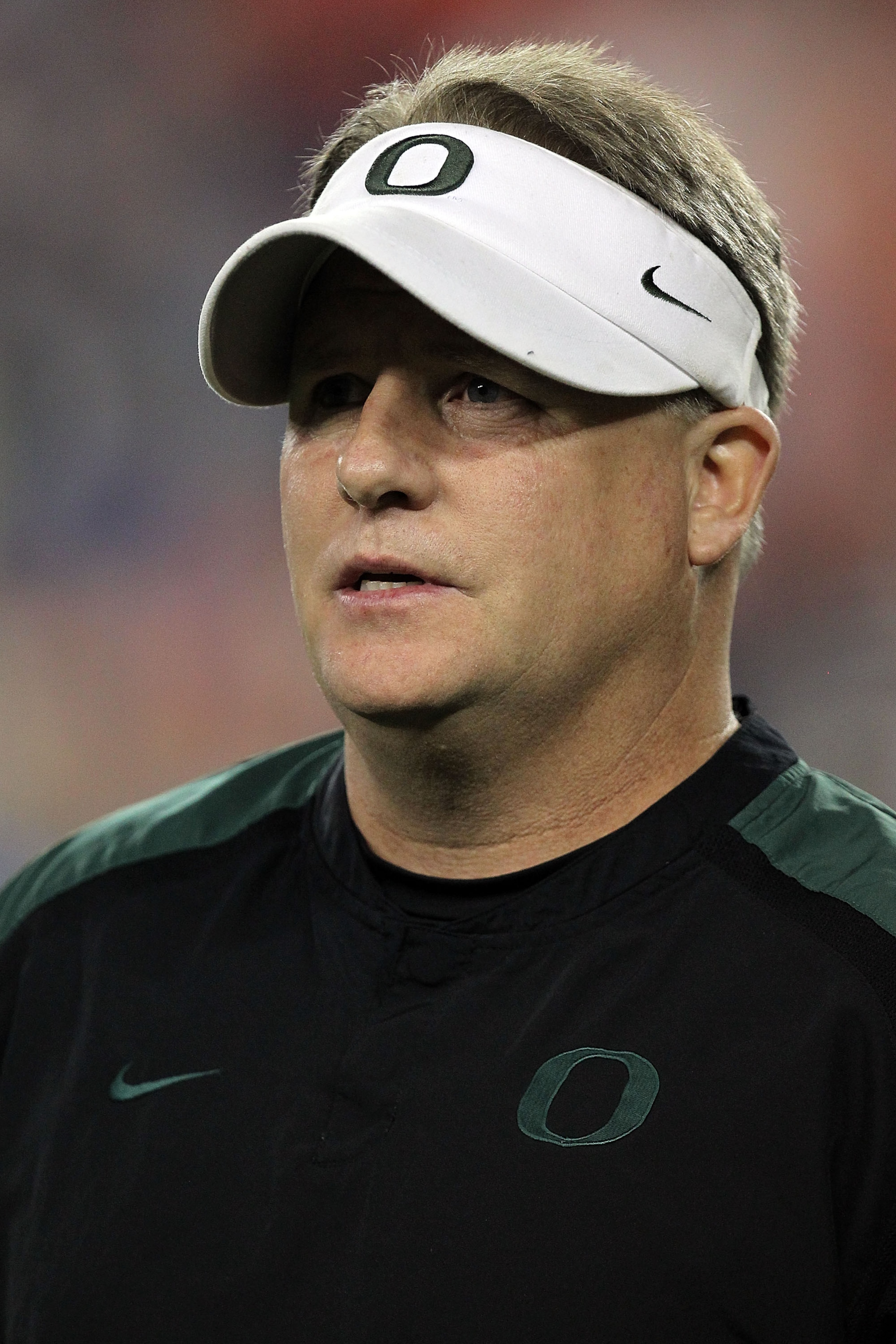 GLENDALE, AZ - JANUARY 10: Head coach Chip Kelly of the Oregon Ducks looks on before taking on the Auburn Tigers in the Tostitos BCS National Championship Game at University of Phoenix Stadium on January 10, 2011 in Glendale, Arizona. (Photo by Ronald M GLENDALE, AZ - JANUARY 10: Head coach Chip Kelly of the Oregon Ducks looks on before taking on the Auburn Tigers in the Tostitos BCS National Championship Game at University of Phoenix Stadium on January 10, 2011 in Glendale, Arizona. (Photo by Ronald M