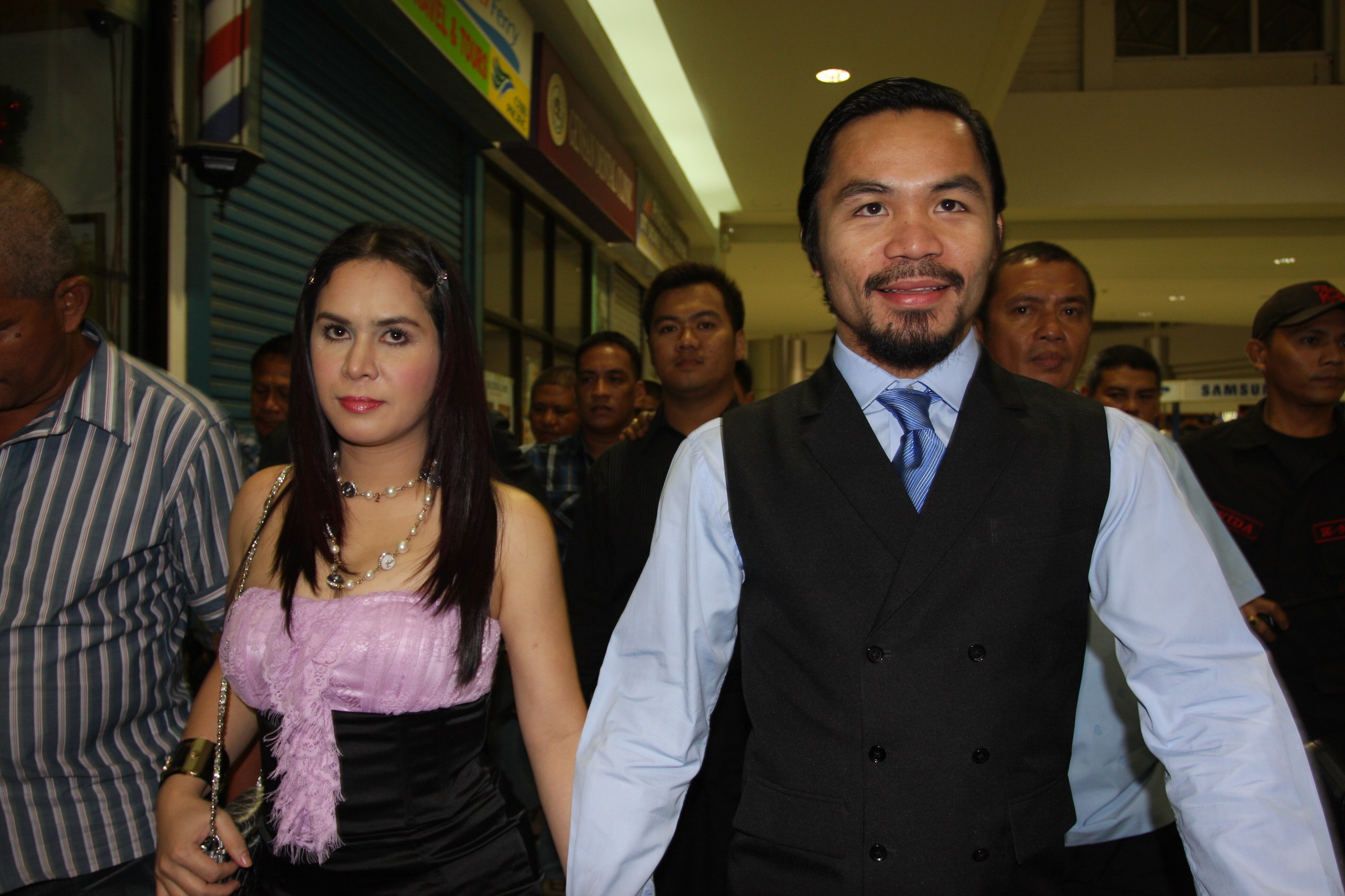 GENERAL SANTOS, PHILIPPINES - MAY 15:  World welterweight boxing champion Manny Pacquiao and wife Jinkee Pacquiao arrive at the KCC Mall on May 15, 2010 in General Santos, Philippines. Pacquiao was there to celebrate his election on becoming a member of H