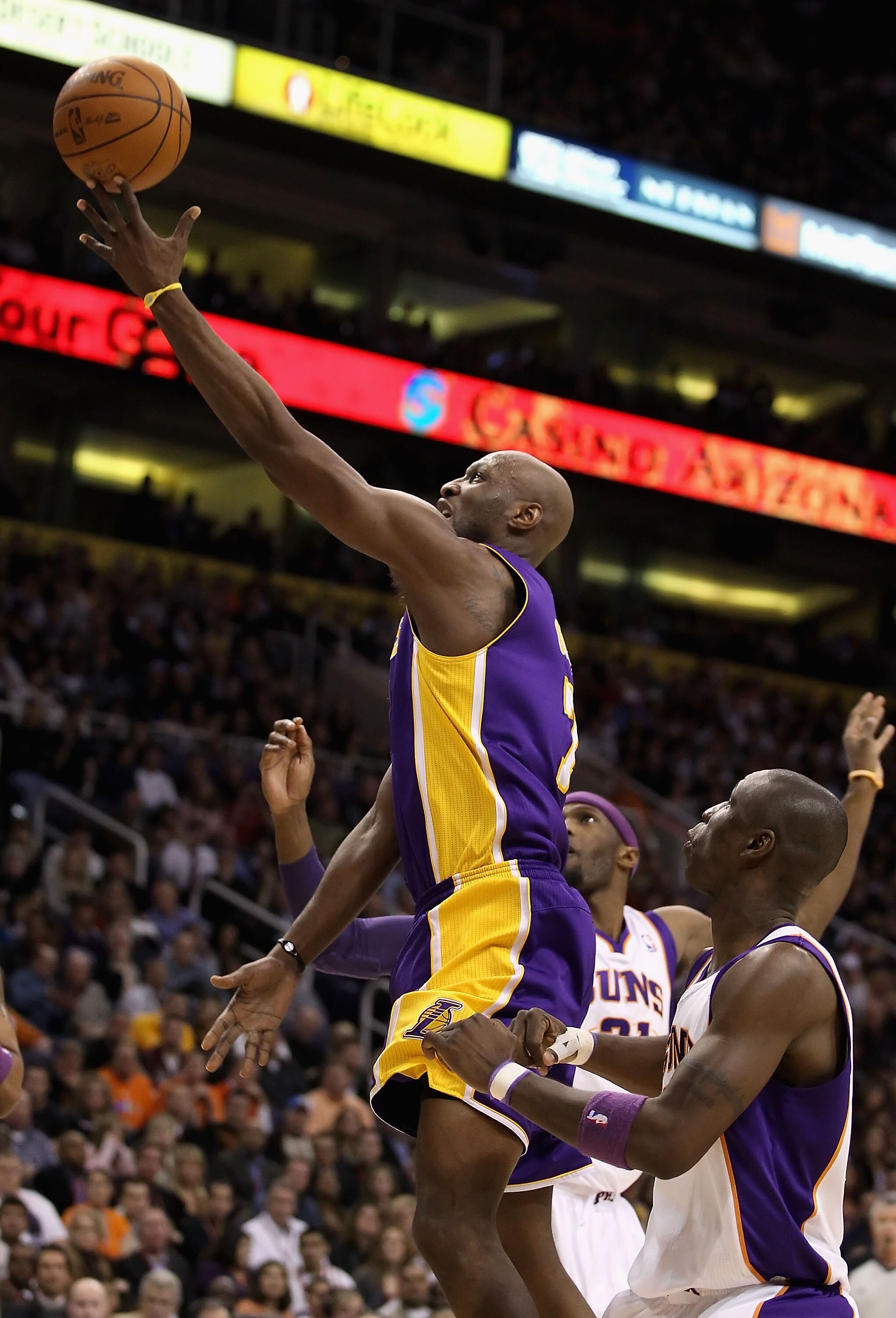 PHOENIX - JANUARY 05: Lamar Odom #7 of the Los Angeles Lakers lays up a shot against the Phoenix Suns during the NBA game at US Airways Center on January 5, 2011 in Phoenix, Arizona. The Lakers defeated the Suns 99-95. NOTE TO USER: User expressly acknowl