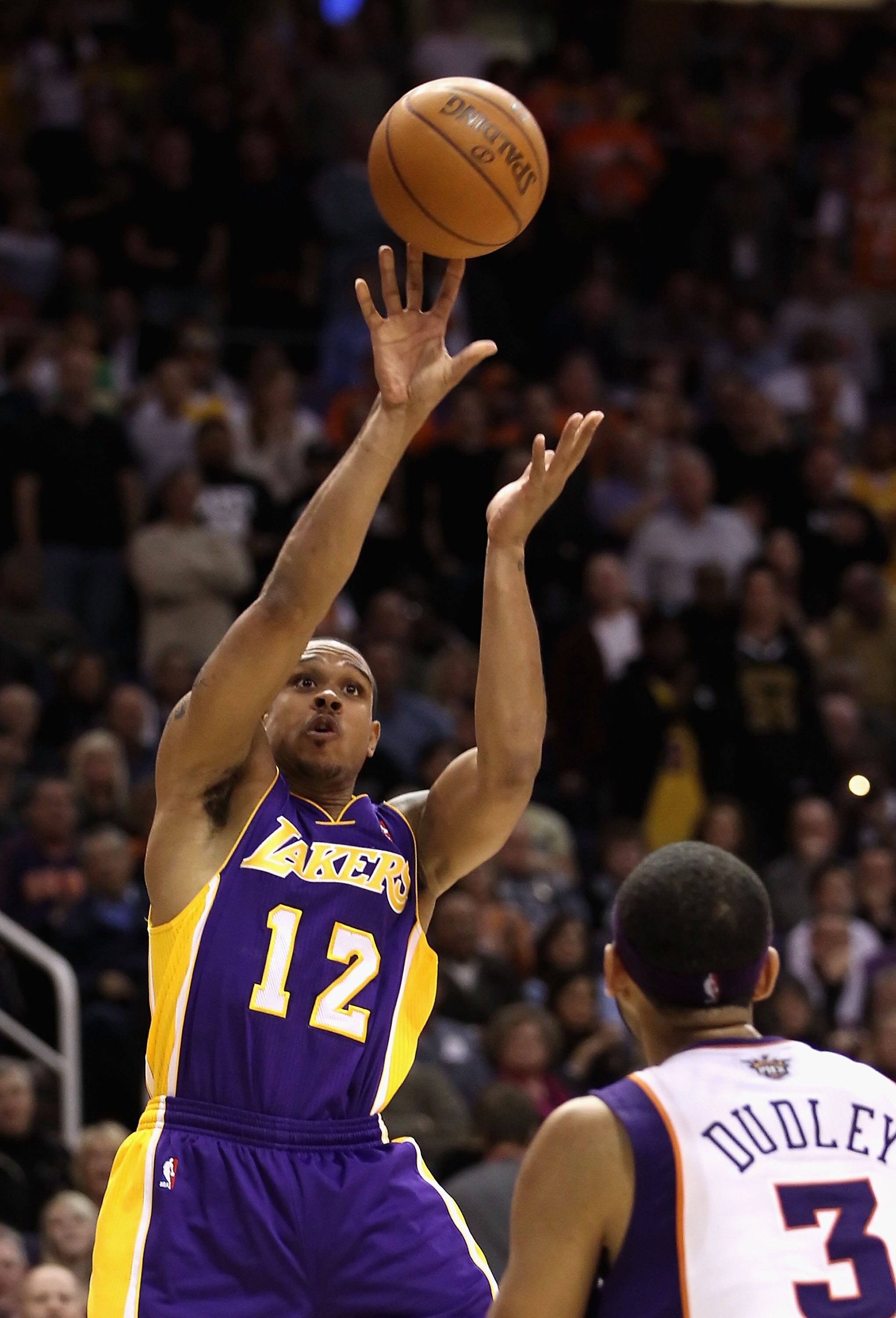 PHOENIX - JANUARY 05: Shannon Brown #12 of the Los Angeles Lakers puts up a shot over Jared Dudley #3 of the Phoenix Suns during the NBA game at US Airways Center on January 5, 2011 in Phoenix, Arizona. The Lakers defeated the Suns 99-95. NOTE TO USER: Us