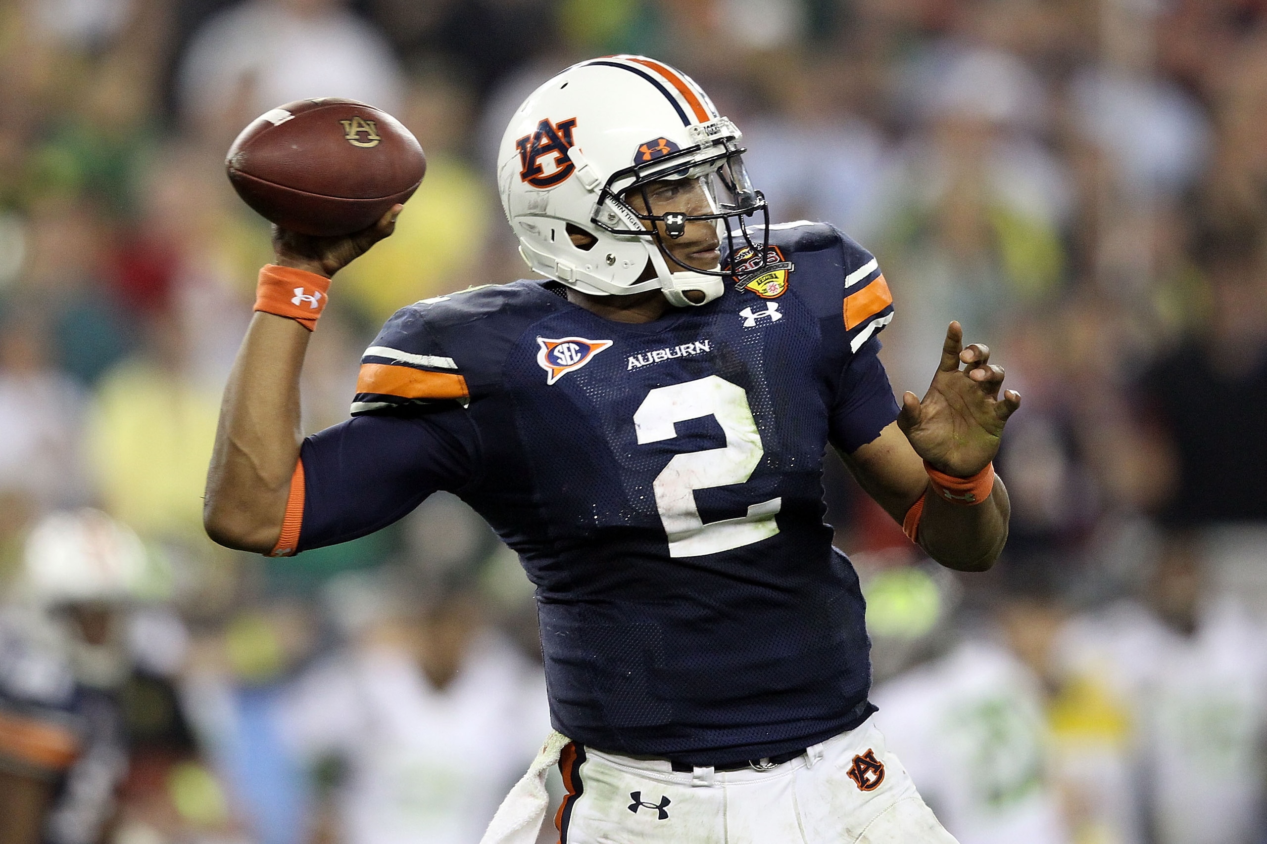 GLENDALE, AZ - JANUARY 10:  Quarterback Cameron Newton #2 of the Auburn Tigers throws the ball in the third quarter against the Oregon Ducks during the Tostitos BCS National Championship Game at University of Phoenix Stadium on January 10, 2011 in Glendal