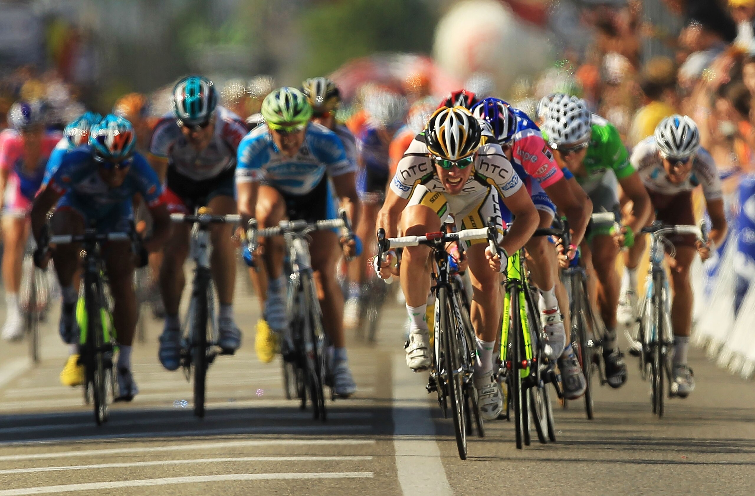 BOURG-LES-VALENCE, FRANCE - JULY 15: Britain Mark Cavendish of team HTC-Columbia crosses the finish to win stage 11 of the Tour de France July 15, 2010 in Bourg-les-Valence, France. The 184.5-km course featured only one moderate climb and ended as expecte