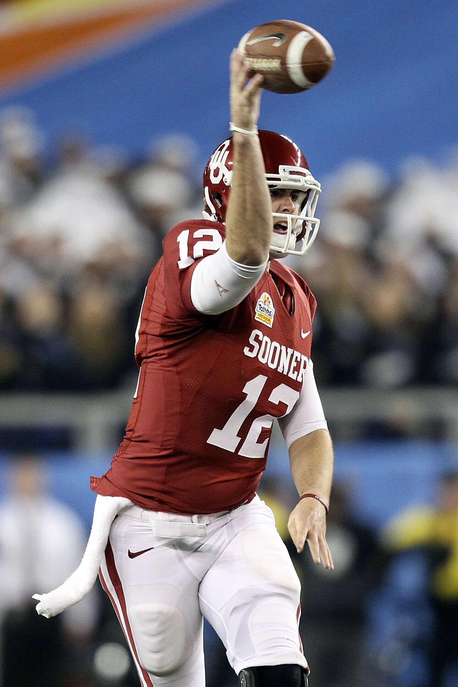 GLENDALE, AZ - JANUARY 01:  Landry Jones #12 of the Oklahoma Sooners throws the ball against the Connecticut Huskies during the Tostitos Fiesta Bowl at the Universtity of Phoenix Stadium on January 1, 2011 in Glendale, Arizona.  (Photo by Christian Peters