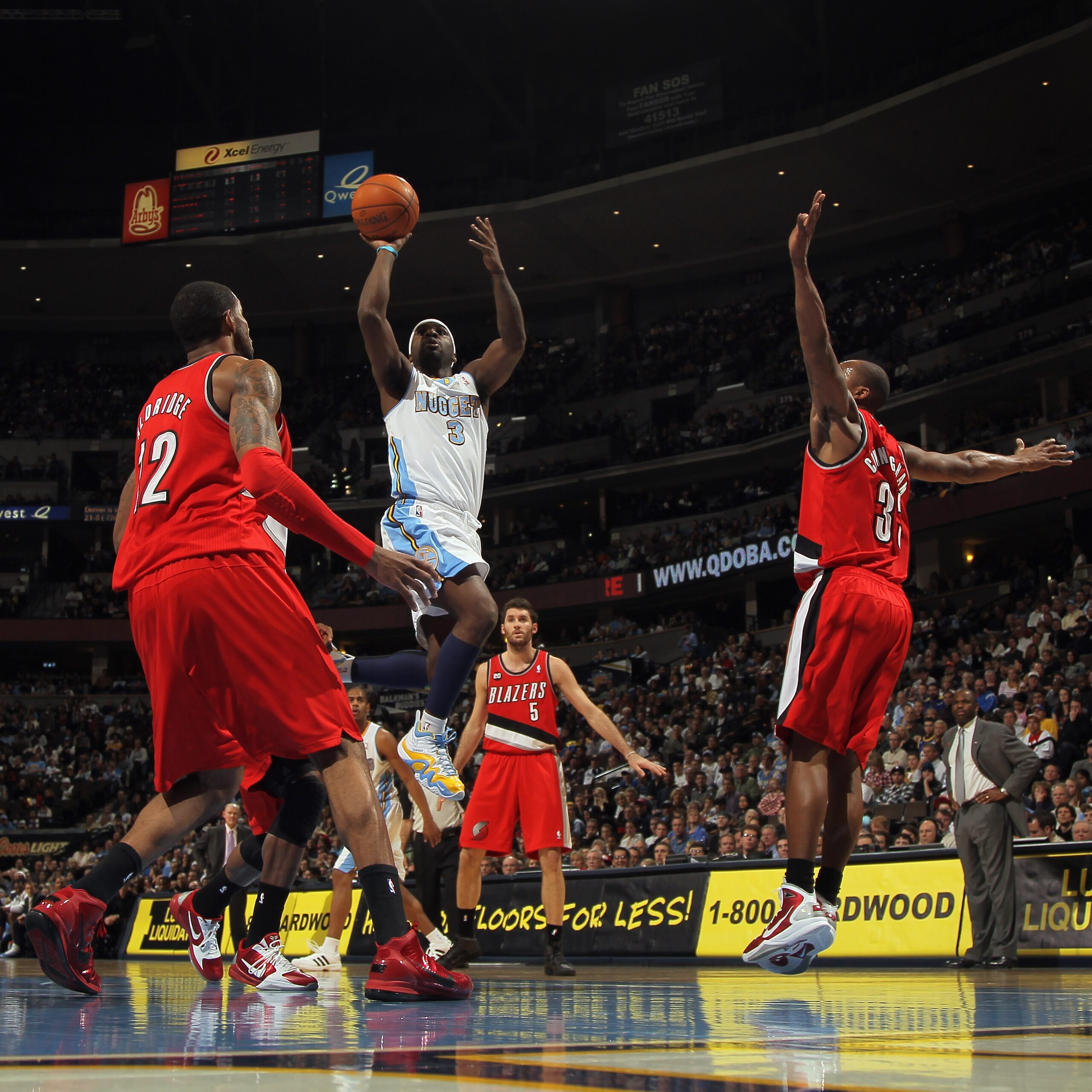 DENVER - DECEMBER 28: Ty Lawson #3 of the Denver Nuggets takes a shot between Wesley Matthews #2 and Dante Cunningham #33 of the Portland Trail Blazers at Pepsi Center on December 28, 2010 in Denver, Colorado. The Nuggets defeated the Blazers 95-77. NOTE DENVER - DECEMBER 28: Ty Lawson #3 of the Denver Nuggets takes a shot between Wesley Matthews #2 and Dante Cunningham #33 of the Portland Trail Blazers at Pepsi Center on December 28, 2010 in Denver, Colorado. The Nuggets defeated the Blazers 95-77. NOTE