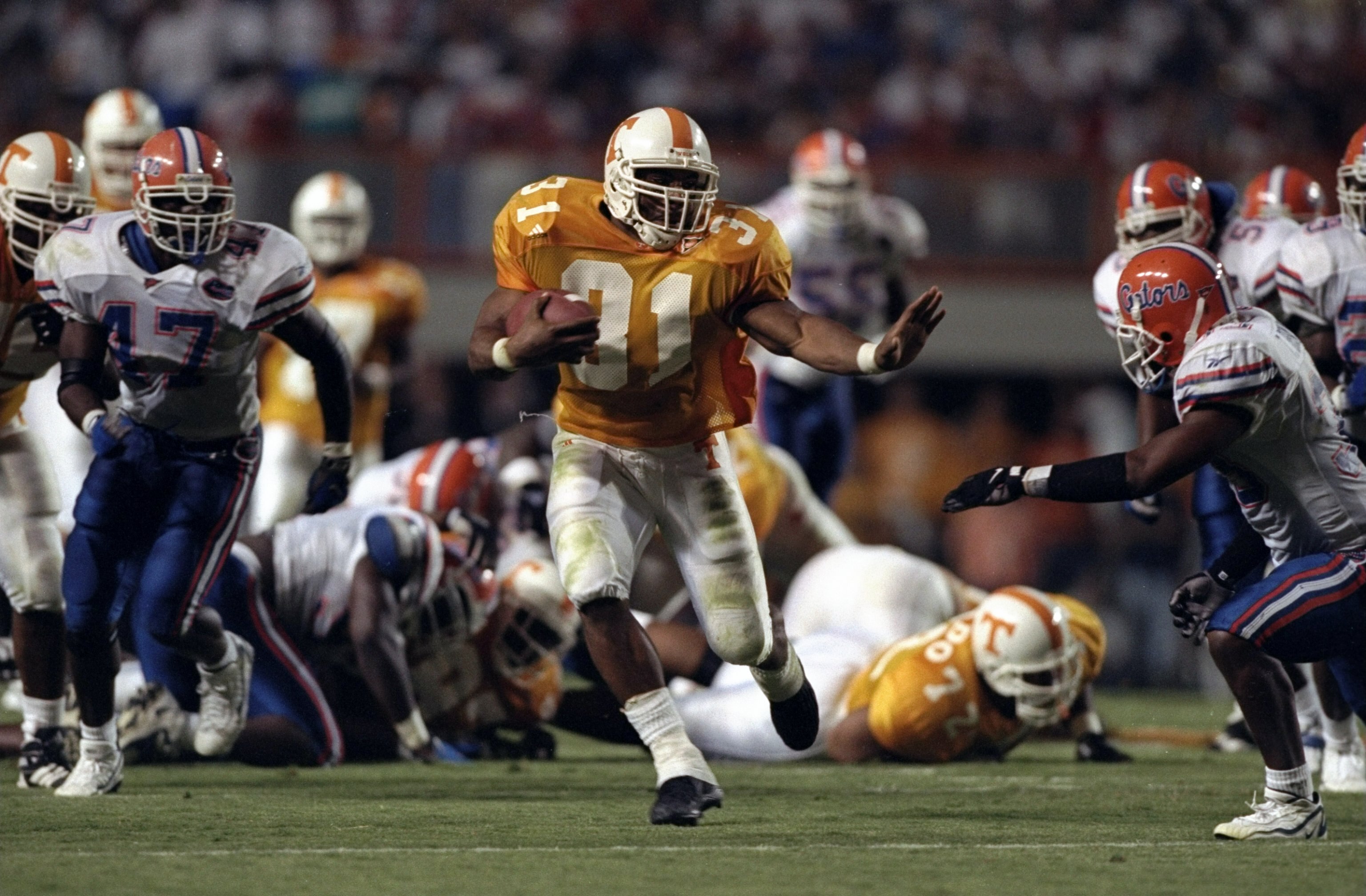 19 Sep 1998:  Running back Jamal Lewis #31 of the Tennessee Volunteers in action against free safety Teako Brown #33 of the Florida Gators during a game at the Neyland Stadium in Knoxville, Tennessee. The Volunteers defeated the Gators 20-17. Mandatory Cr