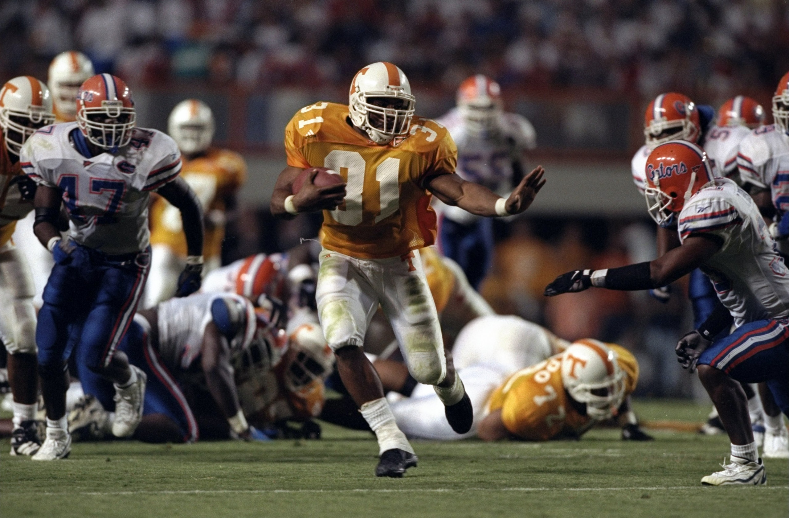 19 Sep 1998:  Running back Jamal Lewis #31 of the Tennessee Volunteers in action against free safety Teako Brown #33 of the Florida Gators during a game at the Neyland Stadium in Knoxville, Tennessee. The Volunteers defeated the Gators 20-17. Mandatory Cr