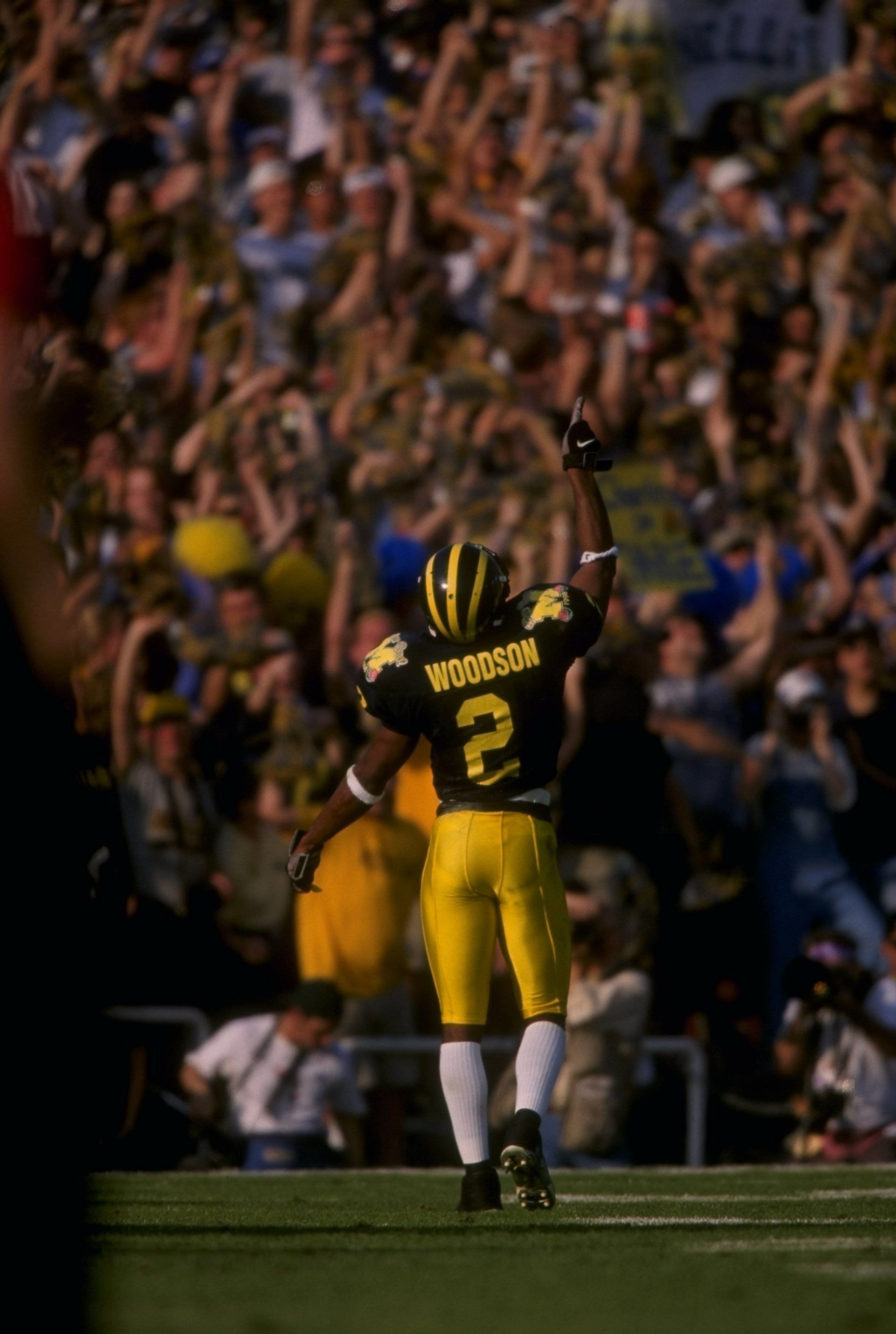 Wide receiver Charles Woodson of the Michigan Wolverines celebrates during the Rose Bowl against the Washington State Cougars at the Rose Bowl in Pasadena, California. Michigan won the game, 21-16.