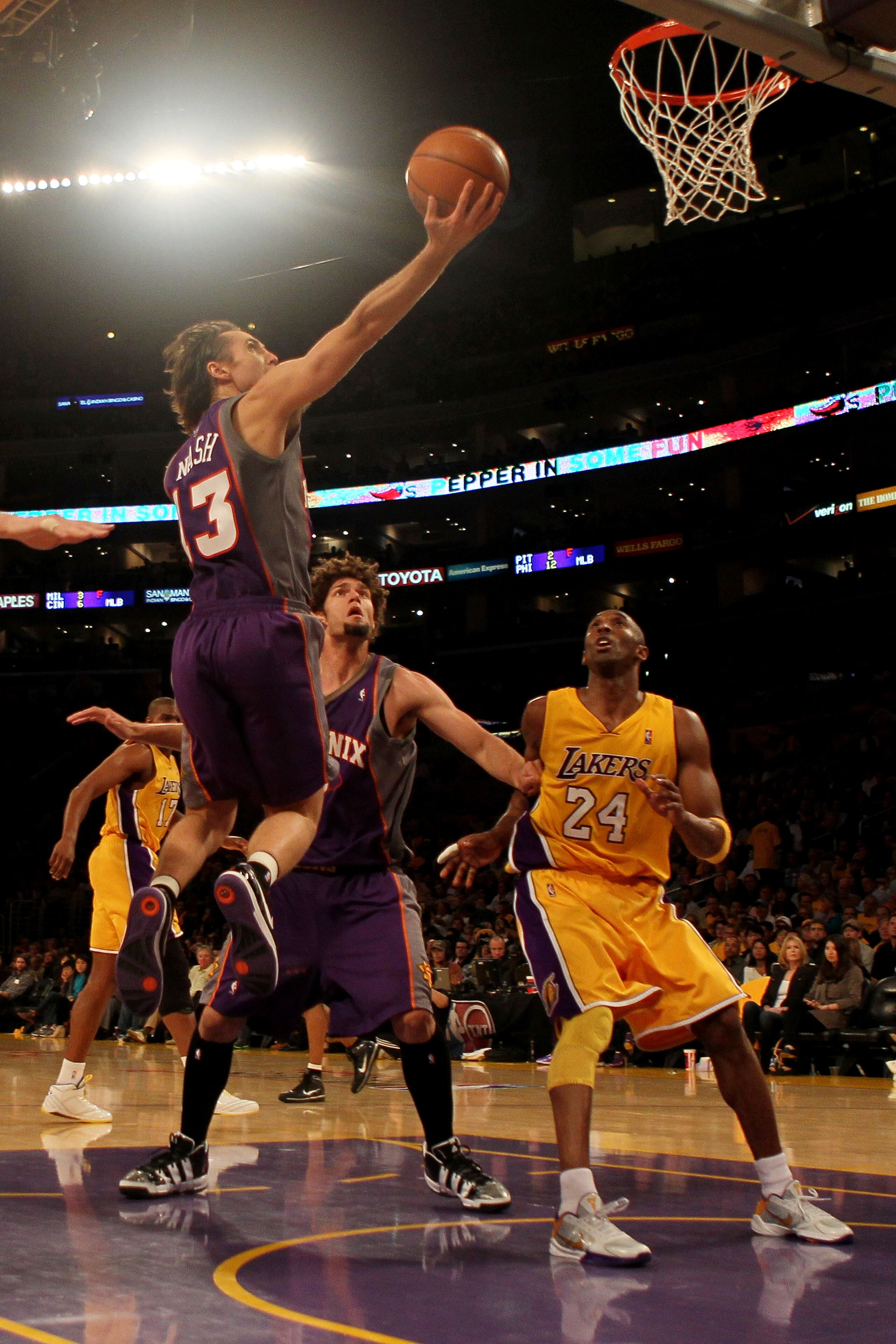LOS ANGELES, CA - MAY 17: Guard Steve Nash #13 of the Phoenix Suns goes up for a shot as guard Kobe Bryant #24 of the Los Angeles Lakers looks on in Game One of the Western Conference Finals during the 2010 NBA Playoffs at Staples Center on May 17, 2010 LOS ANGELES, CA - MAY 17: Guard Steve Nash #13 of the Phoenix Suns goes up for a shot as guard Kobe Bryant #24 of the Los Angeles Lakers looks on in Game One of the Western Conference Finals during the 2010 NBA Playoffs at Staples Center on May 17, 2010