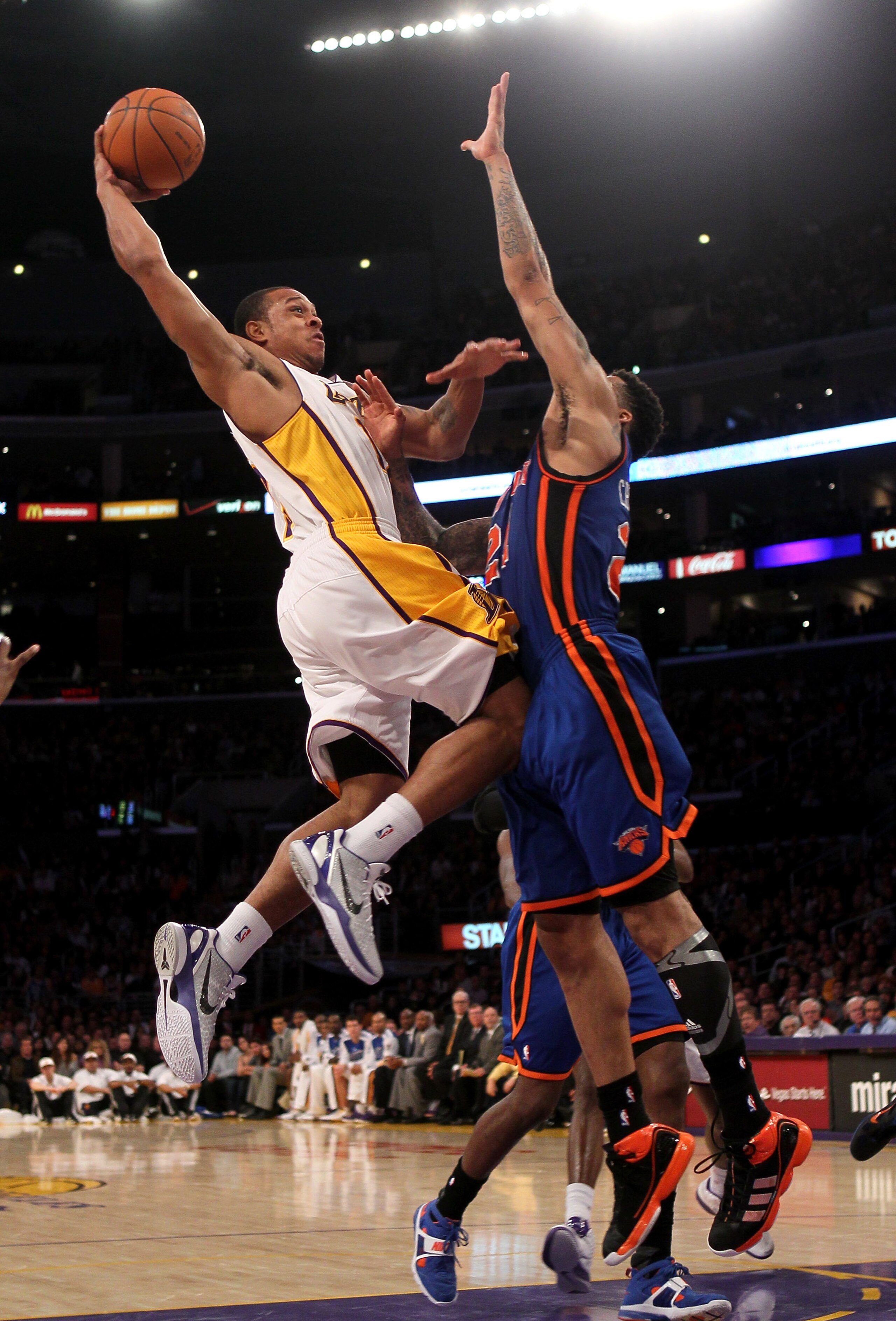 LOS ANGELES, CA - JANUARY 9: Shannon Brown #12 of the Los Angeles Lakers goes up for a shot against Wilson Chandler #21 of the New York Knicks at Staples Center on January 9, 2011 in Los Angeles, California. The Lakers won 109-87. NOTE TO USER: User e LOS ANGELES, CA - JANUARY 9: Shannon Brown #12 of the Los Angeles Lakers goes up for a shot against Wilson Chandler #21 of the New York Knicks at Staples Center on January 9, 2011 in Los Angeles, California. The Lakers won 109-87. NOTE TO USER: User e