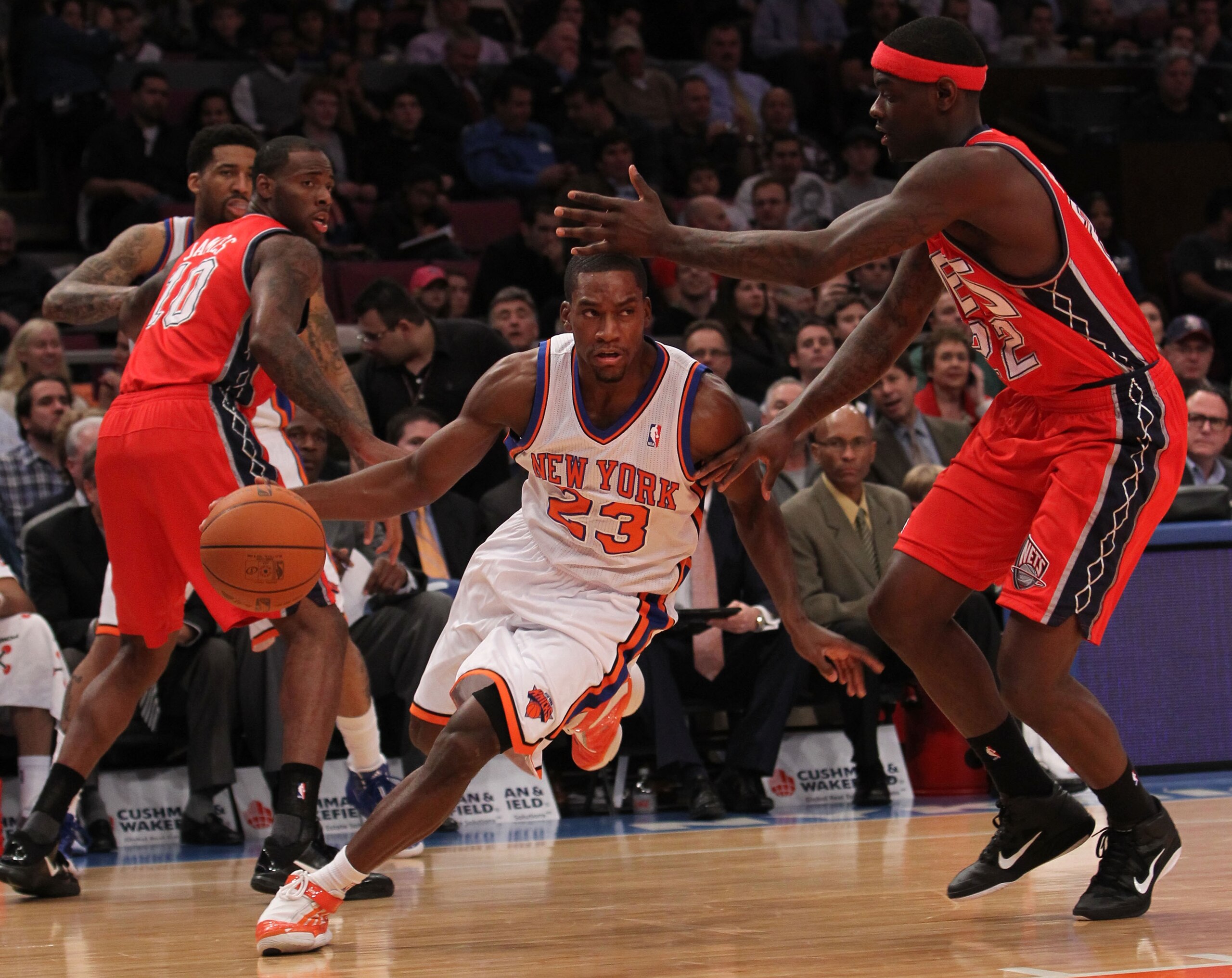 NEW YORK, NY - NOVEMBER 30:  Toney Douglas #23 of the New York Knicks drives to the basket against Anthony Morrow #22 of the New Jersey Nets on November 30, 2010 at Madison Square Garden in New York City. NOTE TO USER: User expressly acknowledges and agre