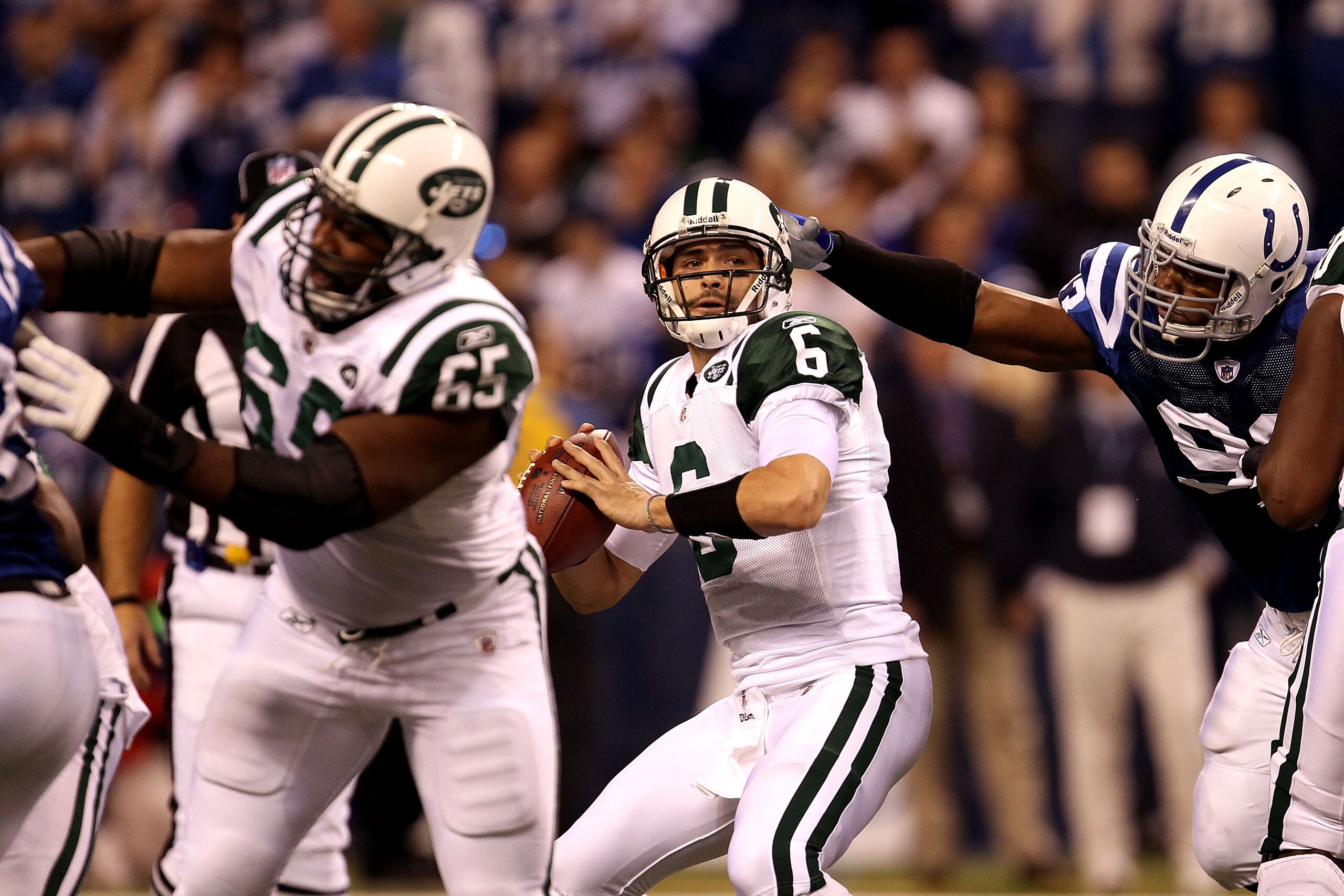 INDIANAPOLIS, IN - JANUARY 08: Quarterback Mark Sanchez #6 of the New York Jets looks to pass the ball against the Indianapolis Colts during their 2011 AFC wild card playoff game at Lucas Oil Stadium on January 8, 2011 in Indianapolis, Indiana. The Jets INDIANAPOLIS, IN - JANUARY 08: Quarterback Mark Sanchez #6 of the New York Jets looks to pass the ball against the Indianapolis Colts during their 2011 AFC wild card playoff game at Lucas Oil Stadium on January 8, 2011 in Indianapolis, Indiana. The Jets