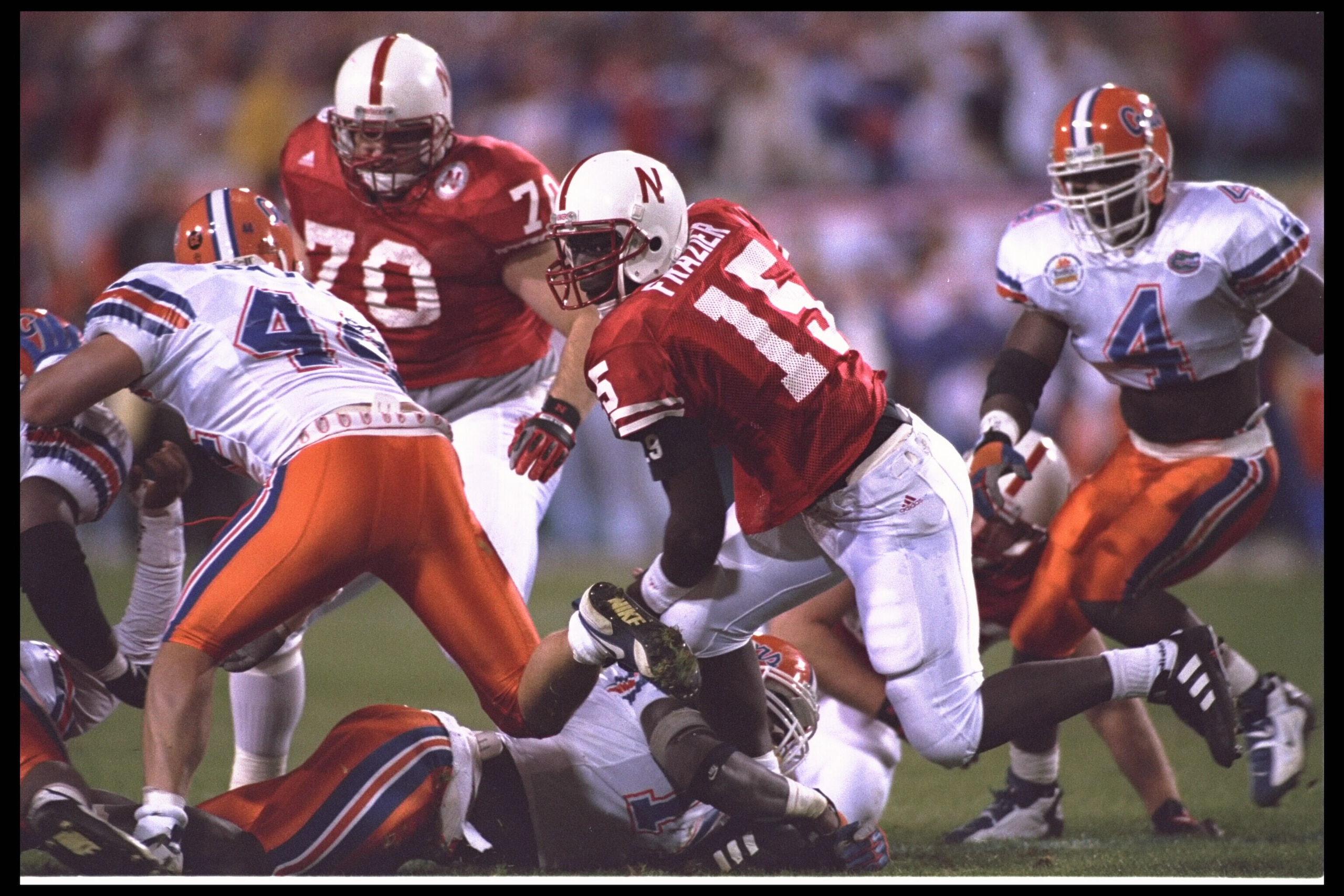 2 Jan 1996:  Quarterback Tommie Frazier #15 of the Nebraska Cornhuskers is sacked by the Florida Gators including linebacker Dexter Daniel #48 of the Florida Gators in the Fiesta Bowl at Sun Devil Stadium in Tempe, Arizona.  Nebraska defeated Florida 62-2
